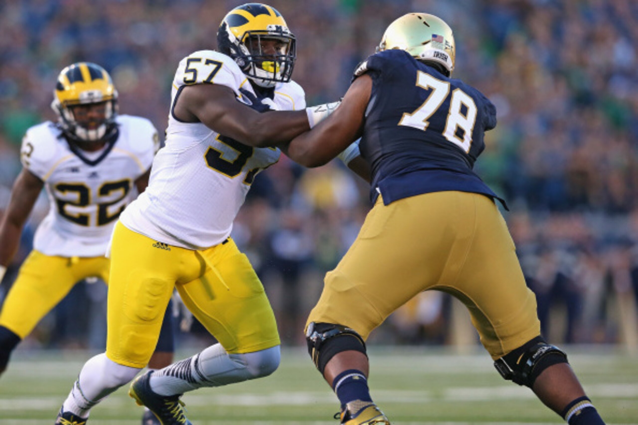 SOUTH BEND, IN - SEPTEMBER 06:  Frank Clark #57 of the Michigan Wolverines rushes against Ronnie Stanley #78 of the Notre Dame Fighting Irish at Notre Dame Stadium on September 6, 2014 in South Bend, Indiana. Notre Dame defeated Michigan 31-0.  (Photo by 