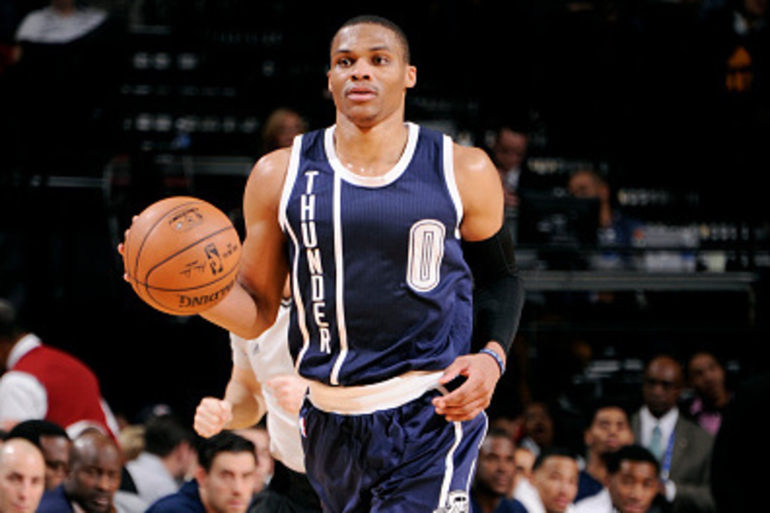 HOUSTON, TX - JANUARY 15: Russell Westbrook #0 of the Oklahoma City Thunder drives against the Houston Rockets on January 15, 2015 at the Toyota Center in Houston, Texas. NOTE TO USER: User expressly acknowledges and agrees that, by downloading and or usi