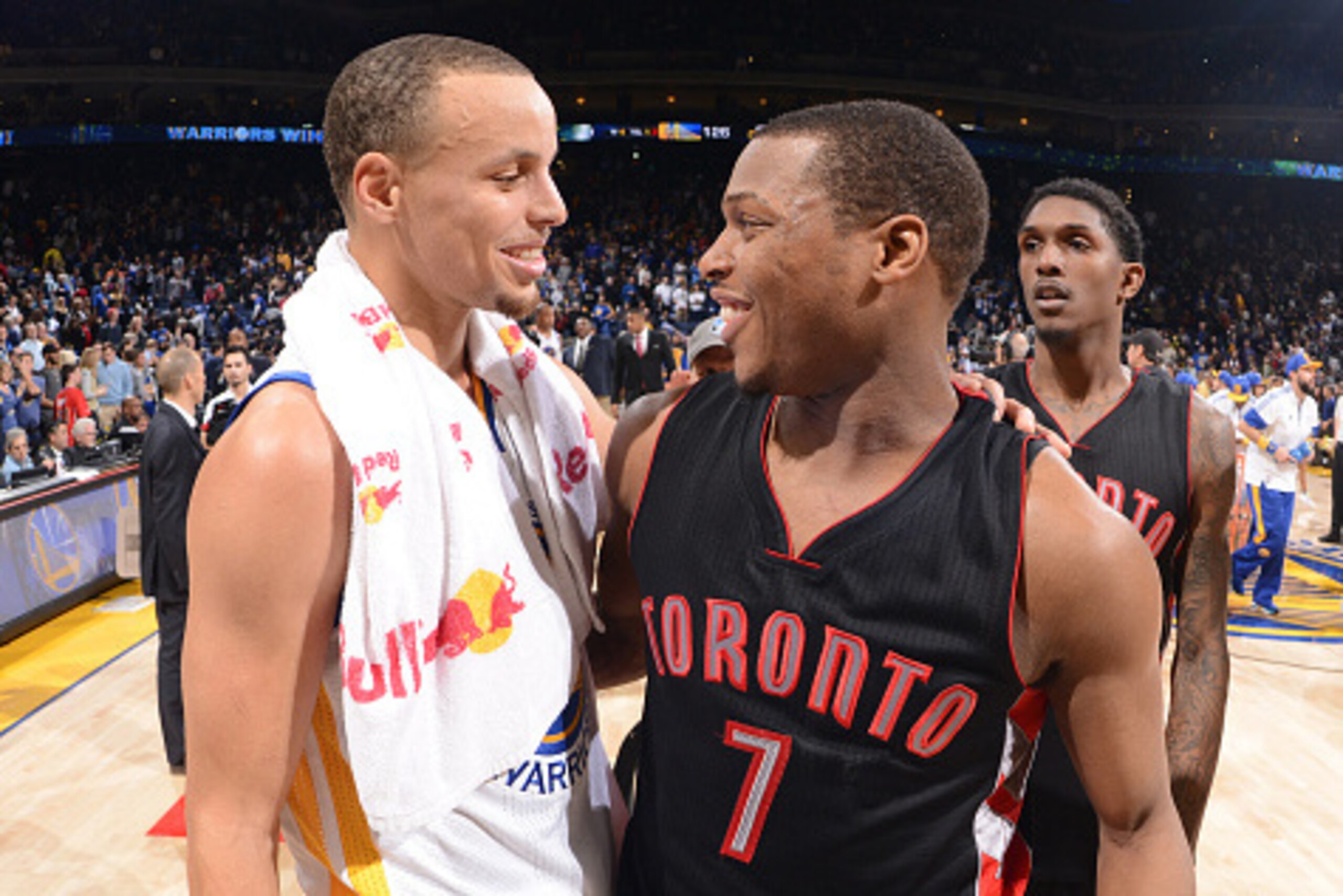 OAKLAND, CA - JANUARY 2: Stephen Curry #30 of the Golden State Warriors and Kyle Lowry #7 of the Toronto Raptors talk after the game on January 2, 2015 at Oracle Arena in Oakland, California. NOTE TO USER: User expressly acknowledges and agrees that, by d