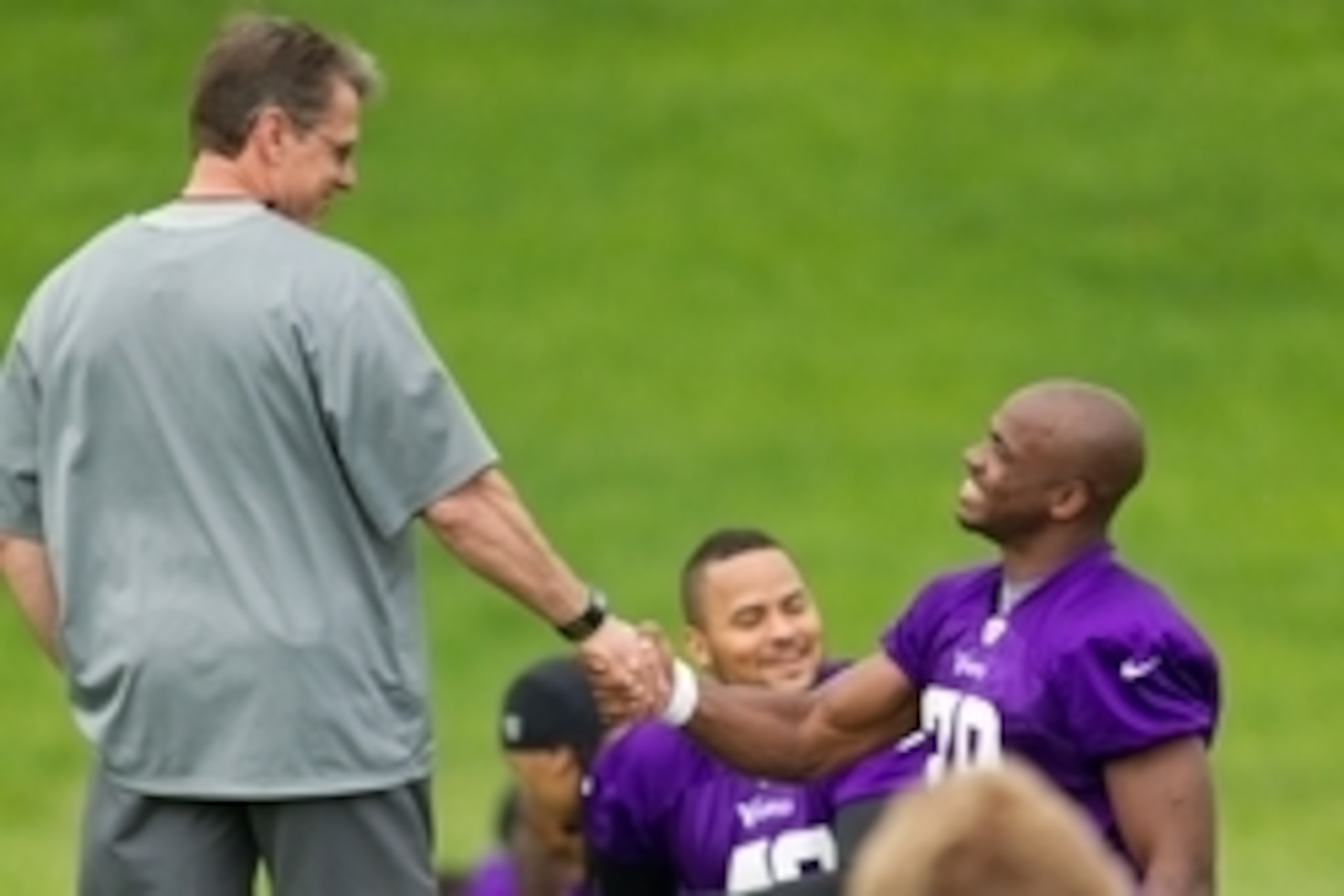 May 29, 2013; Eden Prairie, MN, USA; Minnesota Vikings general manager Rick Spielman shakes hands with running back Adrian Peterson (28) at the Minnesota Vikings OTA at Winter Park. Mandatory Credit: Bruce Kluckhohn-USA TODAY Sports