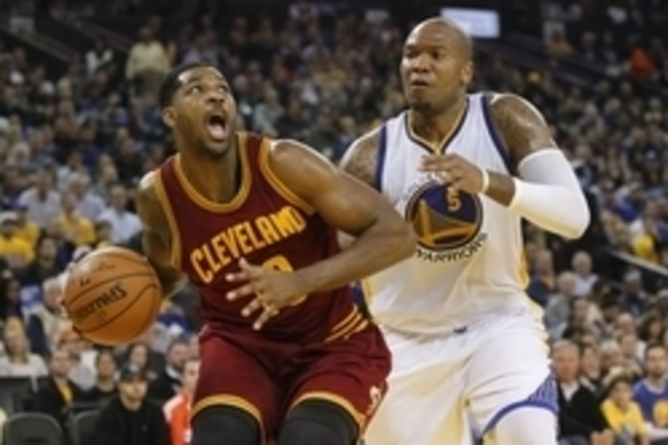 Jan 9, 2015; Oakland, CA, USA; Cleveland Cavaliers center Tristan Thompson (13) drives to the hoop next to Golden State Warriors center Marreese Speights (5) in the second quarter at Oracle Arena. Mandatory Credit: Cary Edmondson-USA TODAY Sports