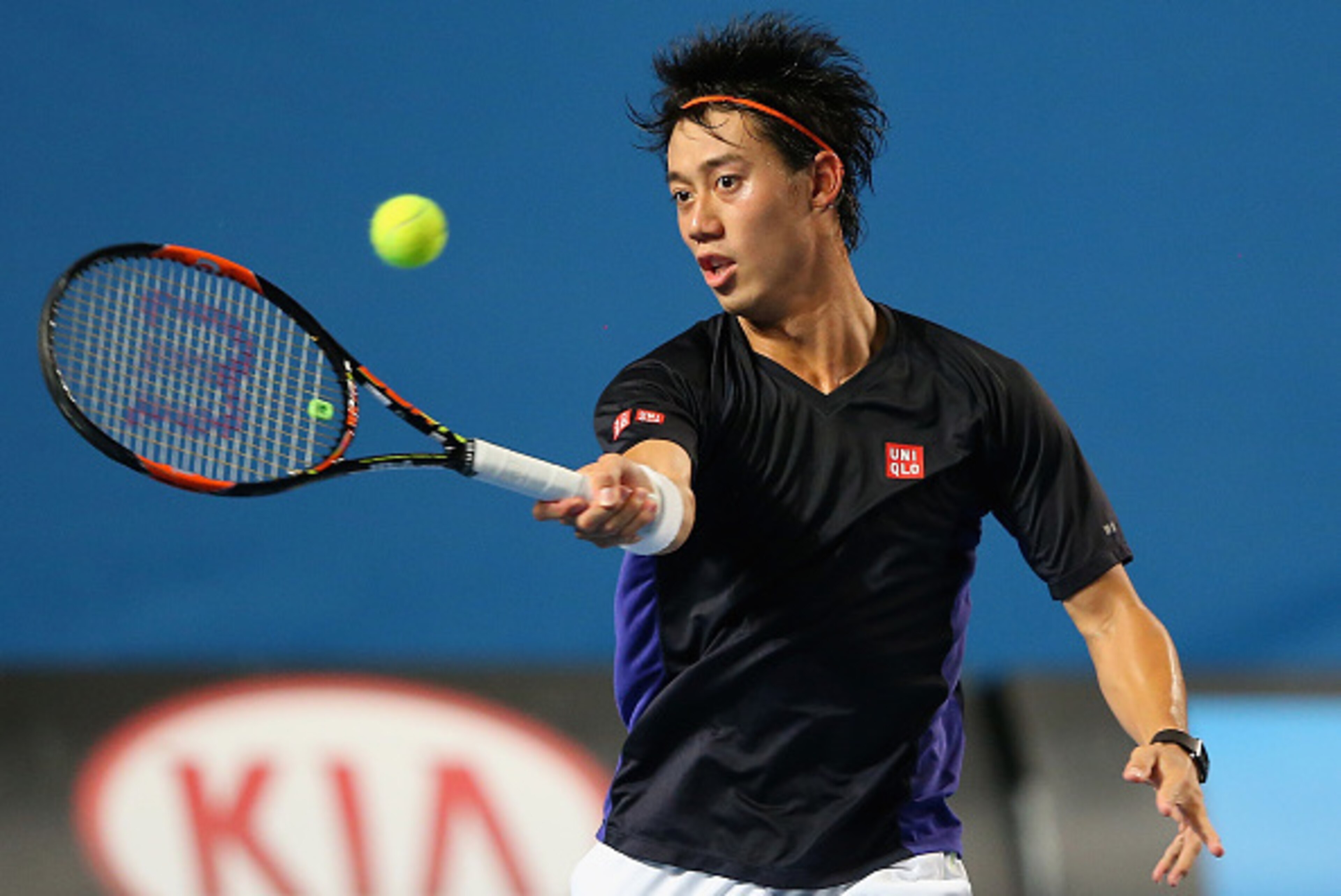 MELBOURNE, AUSTRALIA - JANUARY 13:  Kei Nishikori  of Japan plays a forehand volley during a practice session ahead of the 2015 Australian Open at Melbourne Park on January 13, 2015 in Melbourne, Australia.  (Photo by Quinn Rooney/Getty Images)