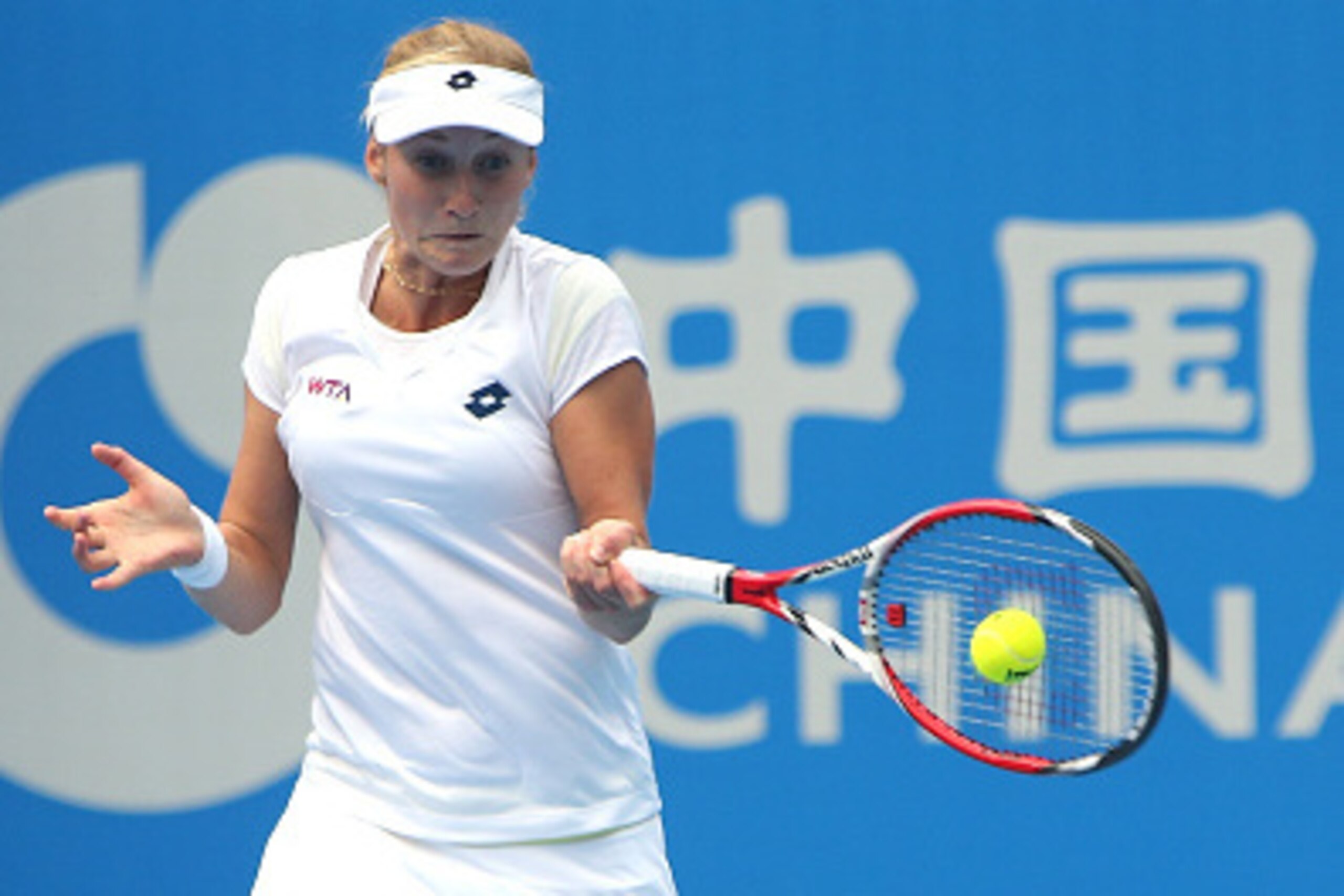 BEIJING, CHINA - SEPTEMBER 28:  Ekaterina Makarova of the Russia returns a shot against Garbine  Muguruza of the Spain during day two of the China Open at the China National Tennis Center on September 28, 2014 in Beijing, China.  (Photo by Emmanuel Wong/G