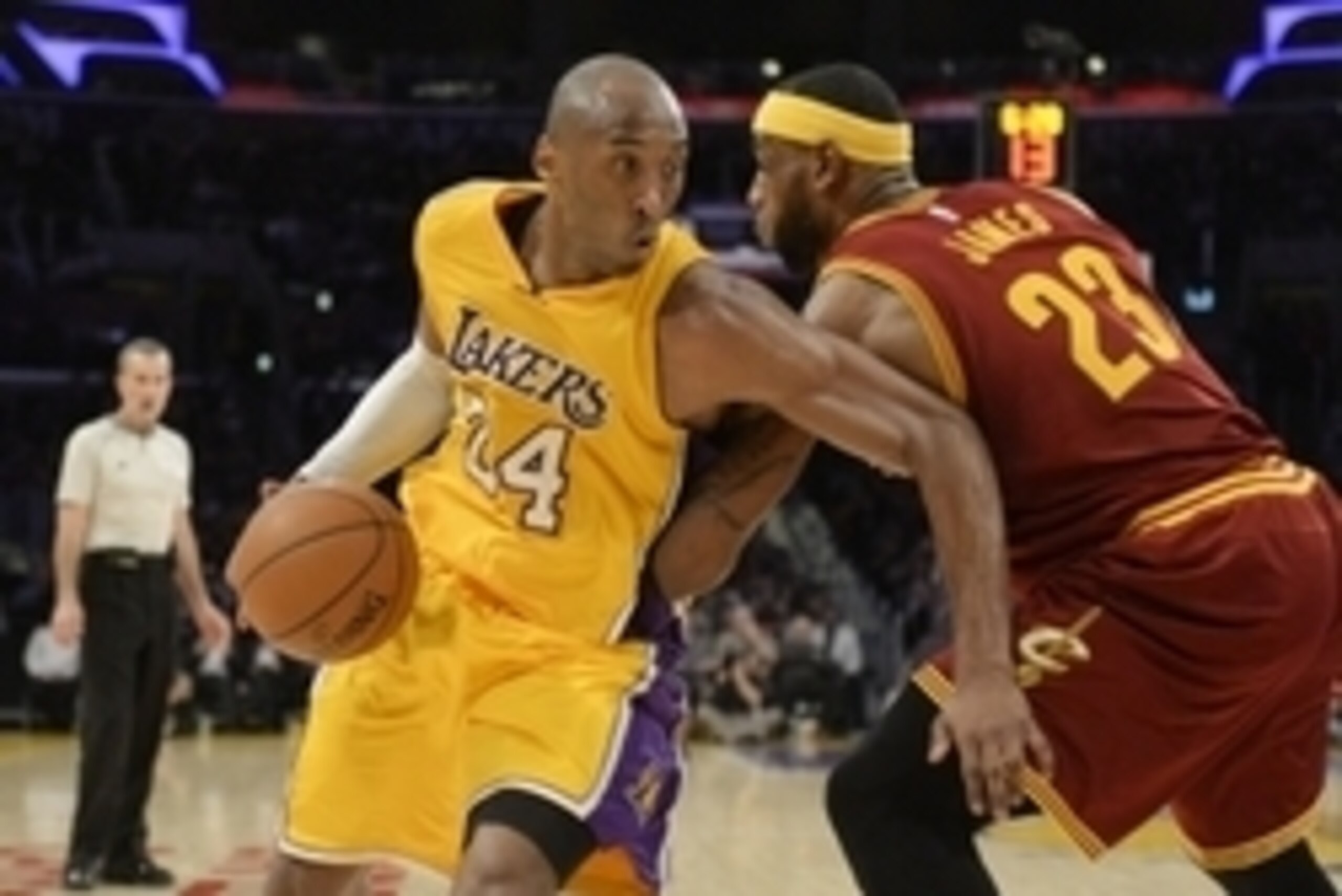 Jan 15, 2015; Los Angeles, CA, USA; Los Angeles Lakers guard Kobe Bryant (24) drives to the basket against Cleveland Cavaliers forward LeBron James (23) in the second half of the NBA game at Staples Center. Mandatory Credit: Richard Mackson-USA TODAY Spor