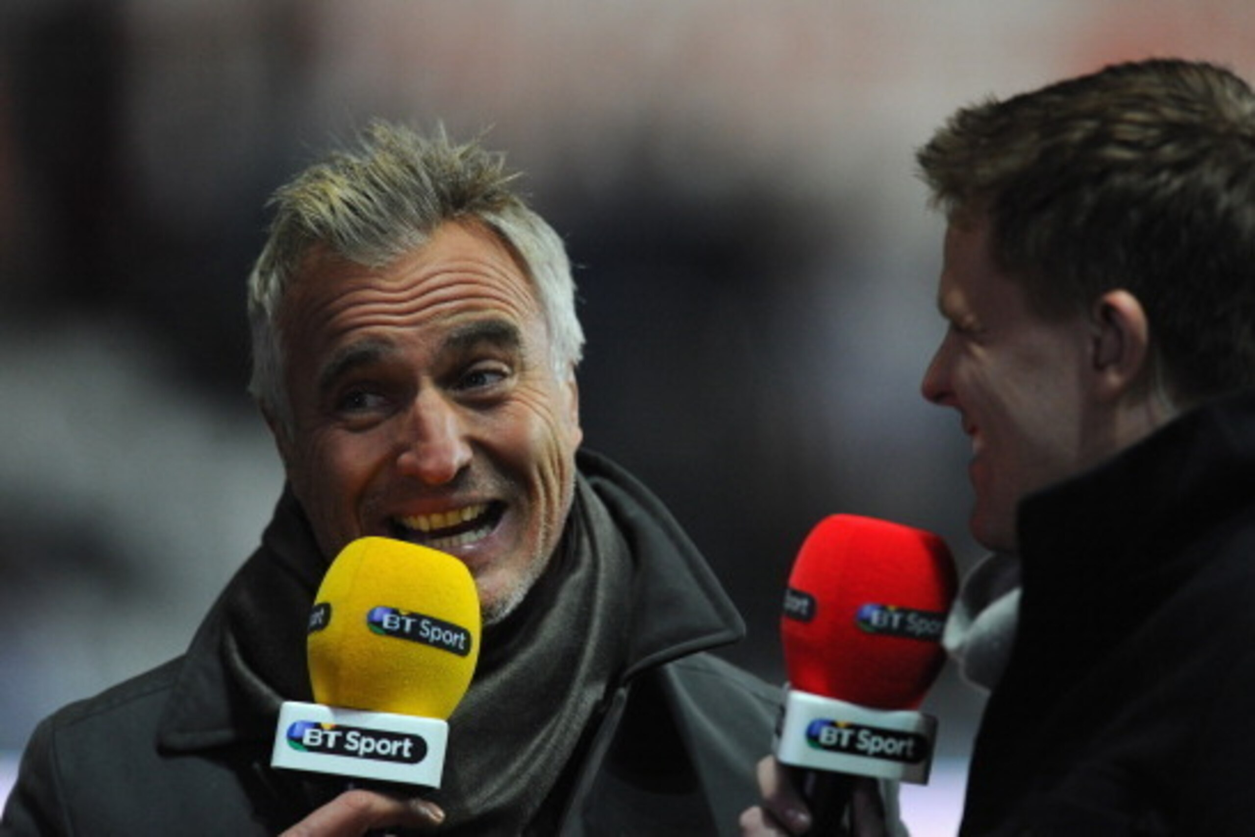 SWANSEA, WALES - DECEMBER 04:  TV pundit David Ginola (l) and presenter Jake Humphrey talk before the Barclays Premier League match between Swansea City and Newcastle United at the Liberty Stadium on December 4, 2013 in Swansea, Wales.  (Photo by Stu Fors