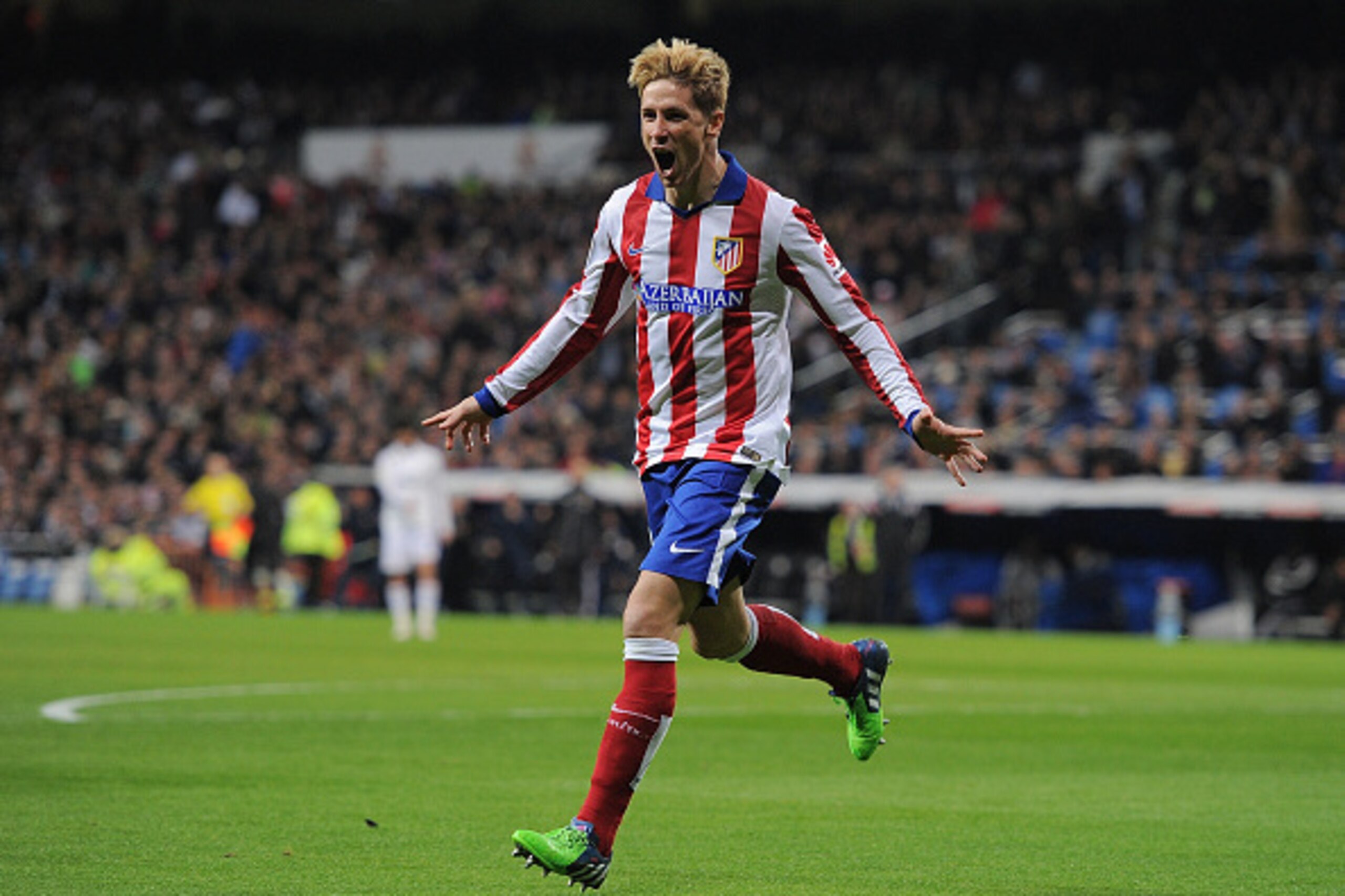 MADRID, SPAIN - JANUARY 15: Fernando Torres of Atletico de Madrid celebrates after scoring Atletico's opening goal during the Copa del Rey Round of 16, Second leg match between Real Madrid and Atletico de Madrid at Estadio Santiago Bernabeu on January 15,