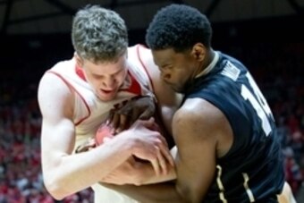 Jan 7, 2015; Salt Lake City, UT, USA; Utah Utes forward Jakob Poeltl (42) and Colorado Buffaloes forward Tory Miller (14) battle for the ball during the second half against the Colorado Buffaloes at Jon M. Huntsman Center. Utah won 74-49. Mandatory Credit