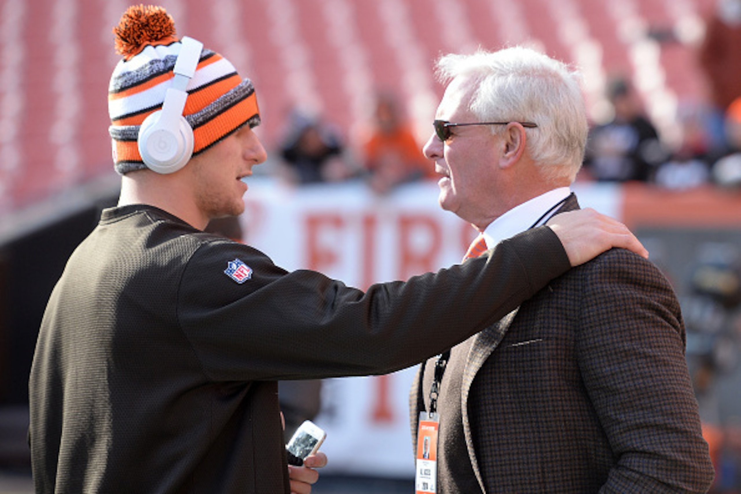 CLEVELAND, OH - DECEMBER 07:  Johnny Manziel #2 of the Cleveland Browns talks with owner Jimmy Haslam prior to the game against the Indianapolis Colts at FirstEnergy Stadium on December 7, 2014 in Cleveland, Ohio.  (Photo by Jason Miller/Getty Images)