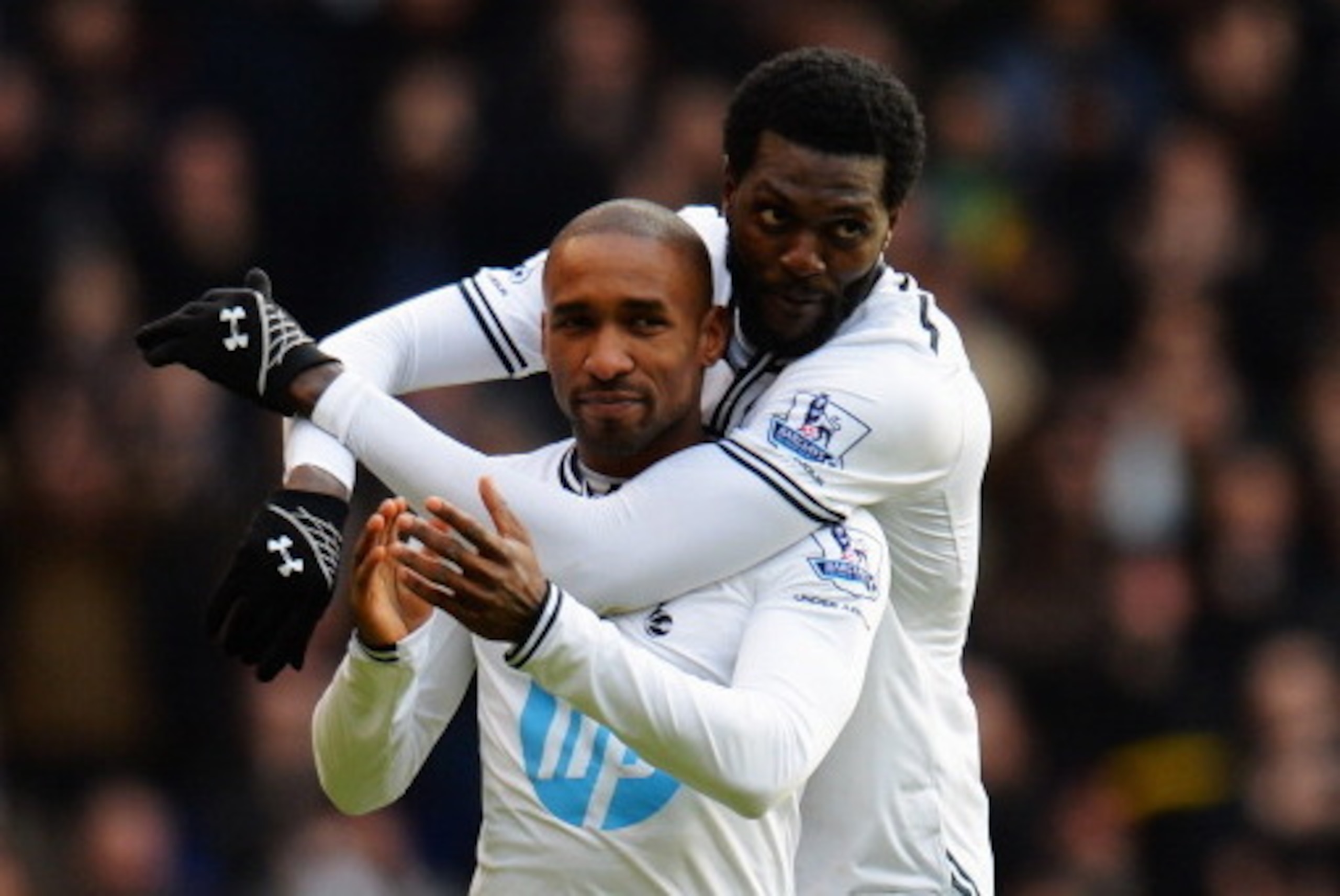 LONDON, ENGLAND - FEBRUARY 09: Jermain Defoe (L) of Tottenham Hotspur is embraced by his team mate Emmanuel Adebayor (R) at the end of his final home game before joining Toronto FC following the Barclays Premier League match between Tottenham Hotspur and LONDON, ENGLAND - FEBRUARY 09: Jermain Defoe (L) of Tottenham Hotspur is embraced by his team mate Emmanuel Adebayor (R) at the end of his final home game before joining Toronto FC following the Barclays Premier League match between Tottenham Hotspur and