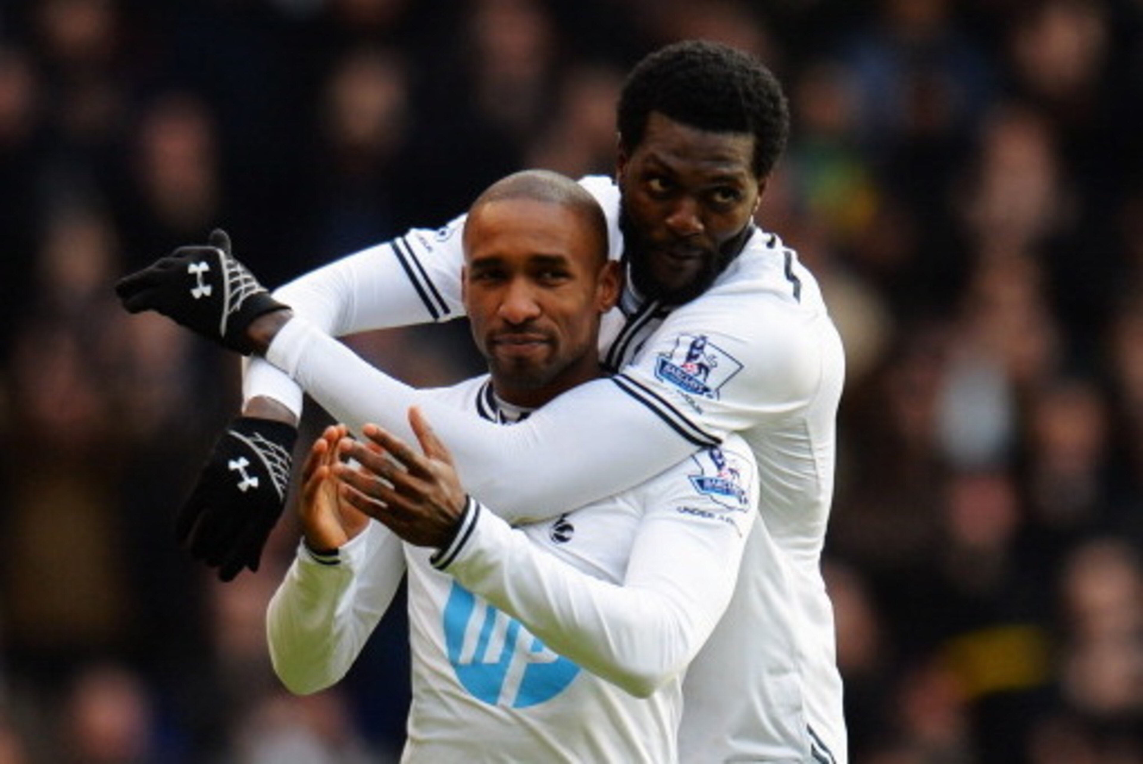 LONDON, ENGLAND - FEBRUARY 09: Jermain Defoe (L) of Tottenham Hotspur is embraced by his team mate Emmanuel Adebayor (R) at the end of his final home game before joining Toronto FC following the Barclays Premier League match between Tottenham Hotspur and LONDON, ENGLAND - FEBRUARY 09: Jermain Defoe (L) of Tottenham Hotspur is embraced by his team mate Emmanuel Adebayor (R) at the end of his final home game before joining Toronto FC following the Barclays Premier League match between Tottenham Hotspur and