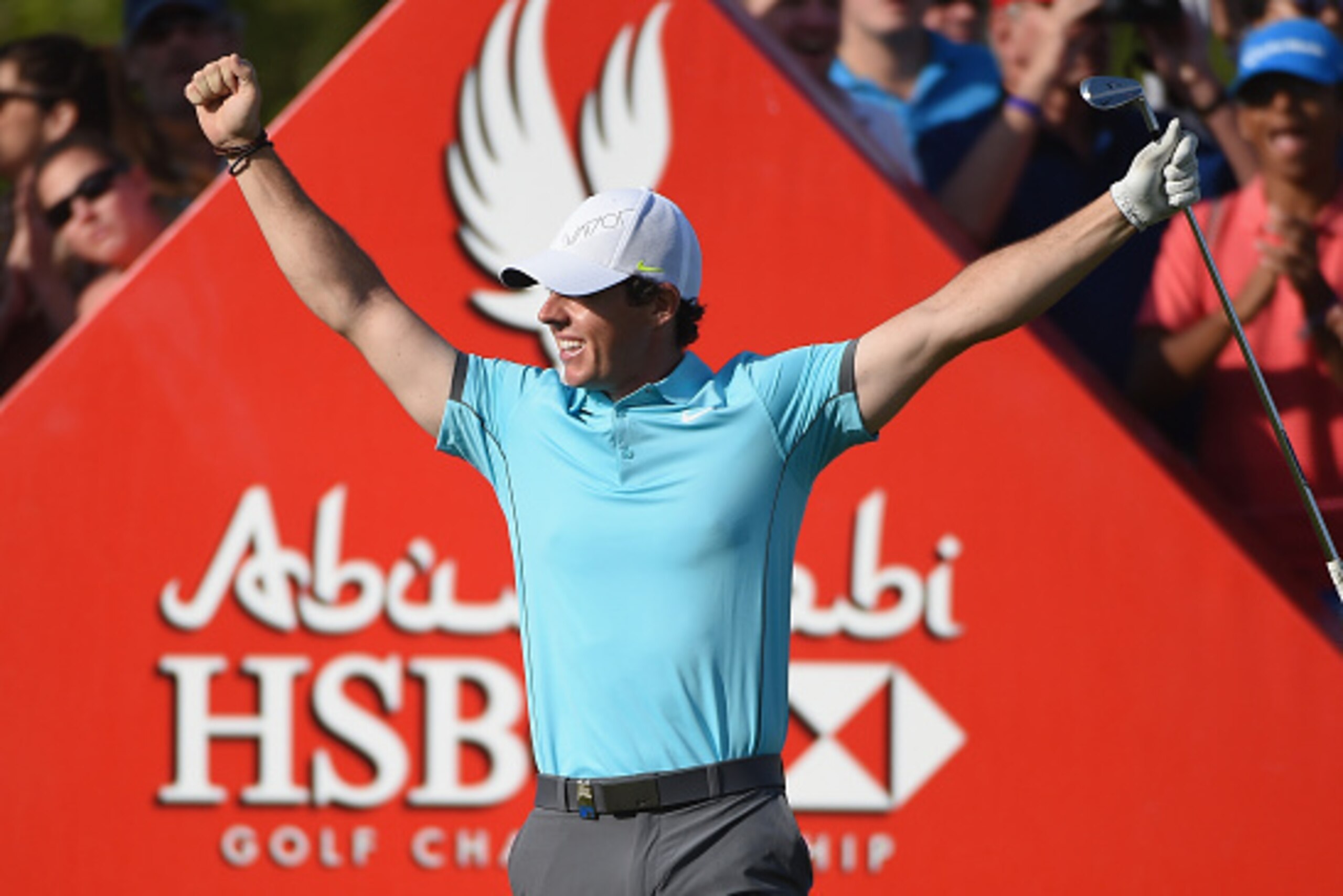 ABU DHABI, UNITED ARAB EMIRATES - JANUARY 16:  Rory McIlroy of Northern Ireland celebrates his 'hole-in-one' on the par three 15th hole during the second round of the Abu Dhabi HSBC Golf Championship at the Abu Dhabi Golf Club on January 16, 2015 in Abu D