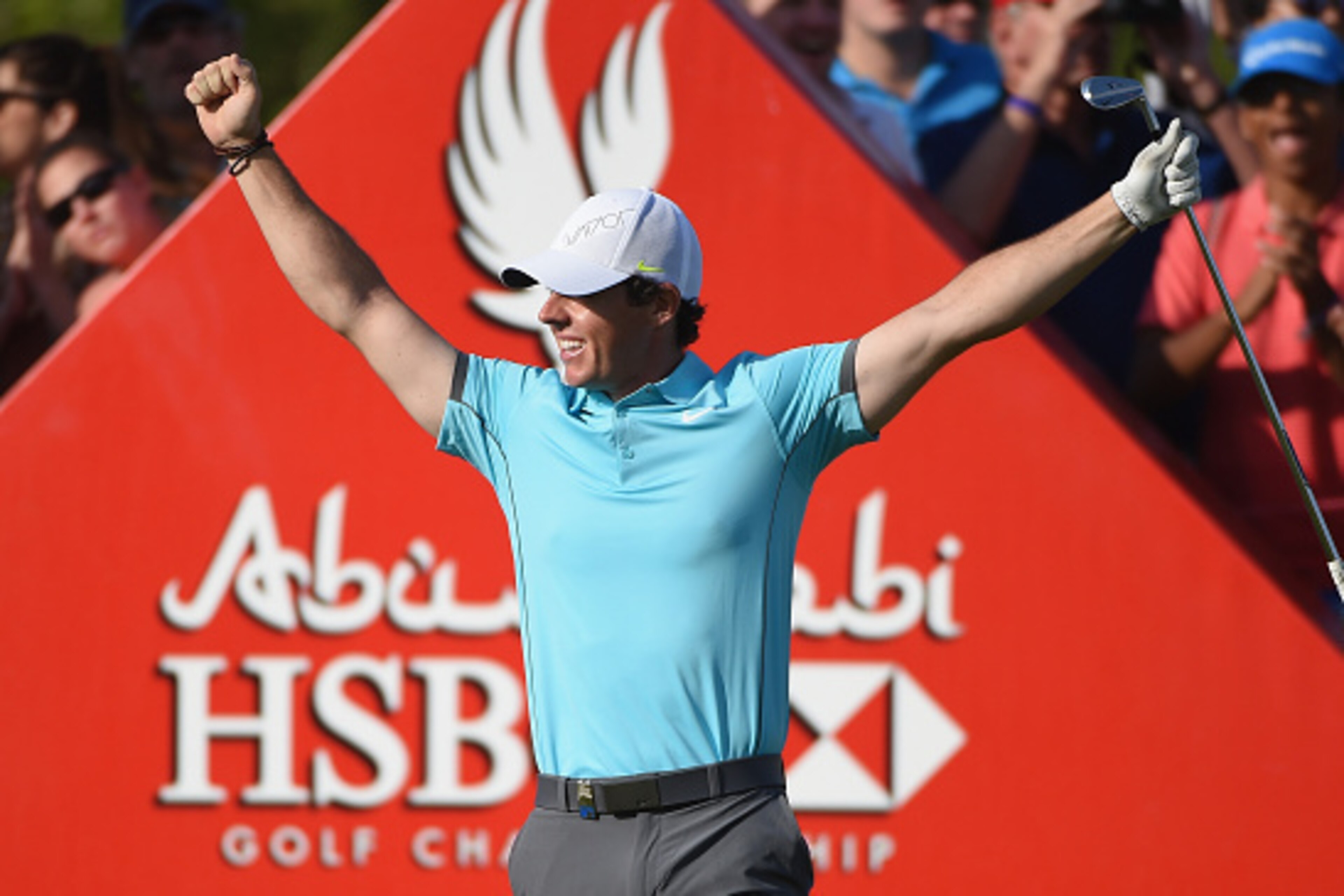 ABU DHABI, UNITED ARAB EMIRATES - JANUARY 16:  Rory McIlroy of Northern Ireland celebrates his 'hole-in-one' on the par three 15th hole during the second round of the Abu Dhabi HSBC Golf Championship at the Abu Dhabi Golf Club on January 16, 2015 in Abu D