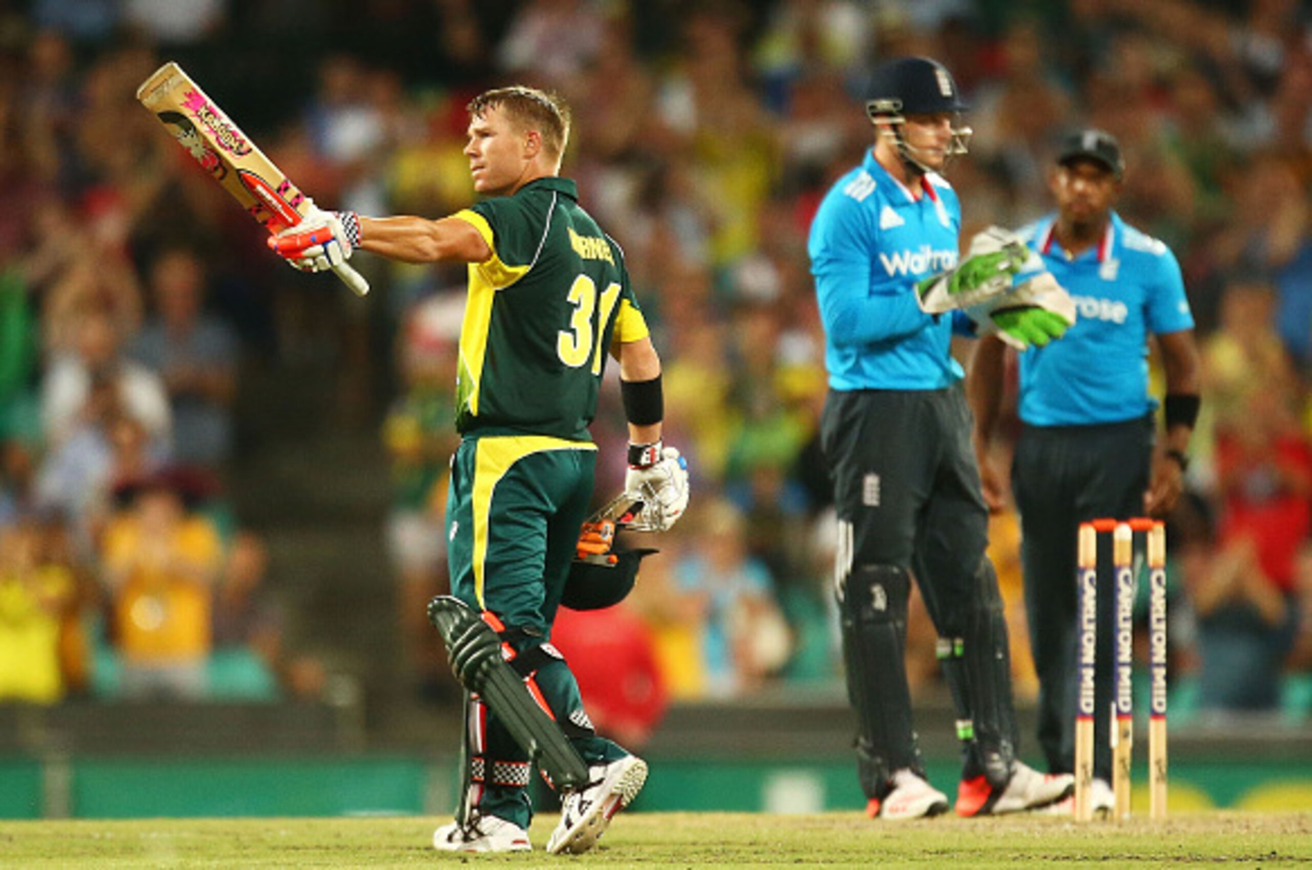 SYDNEY, AUSTRALIA - JANUARY 16:  David Warner of Australia celebrtaes scoring a century during the One Day International series match between Australia and England at Sydney Cricket Ground on January 16, 2015 in Sydney, Australia.  (Photo by Mark Nolan/Ge
