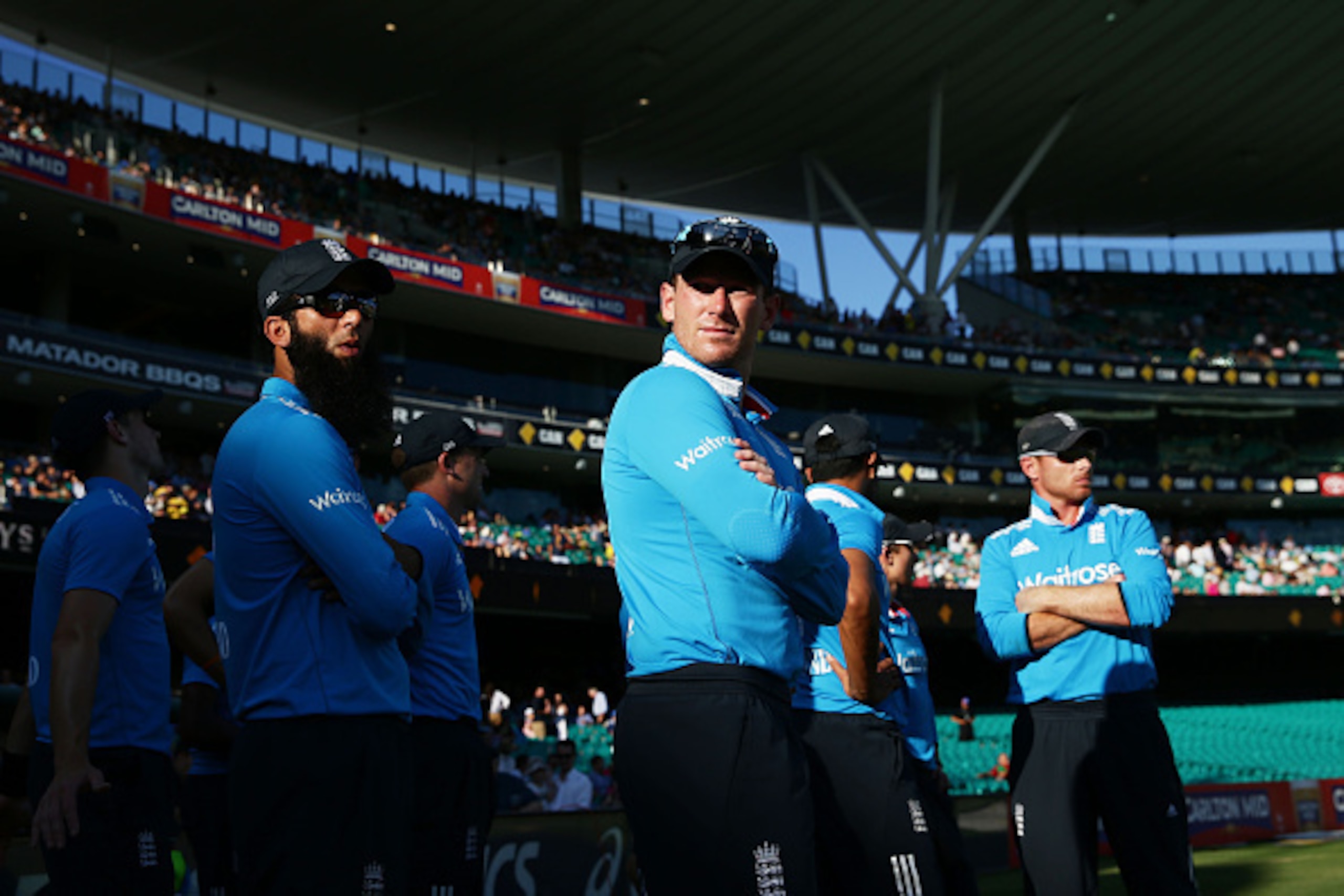 SYDNEY, AUSTRALIA - JANUARY 16:  England captain Eoin Morgan waits with his team to walk onto the field during the One Day International series match between Australia and England at Sydney Cricket Ground on January 16, 2015 in Sydney, Australia.  (Photo 