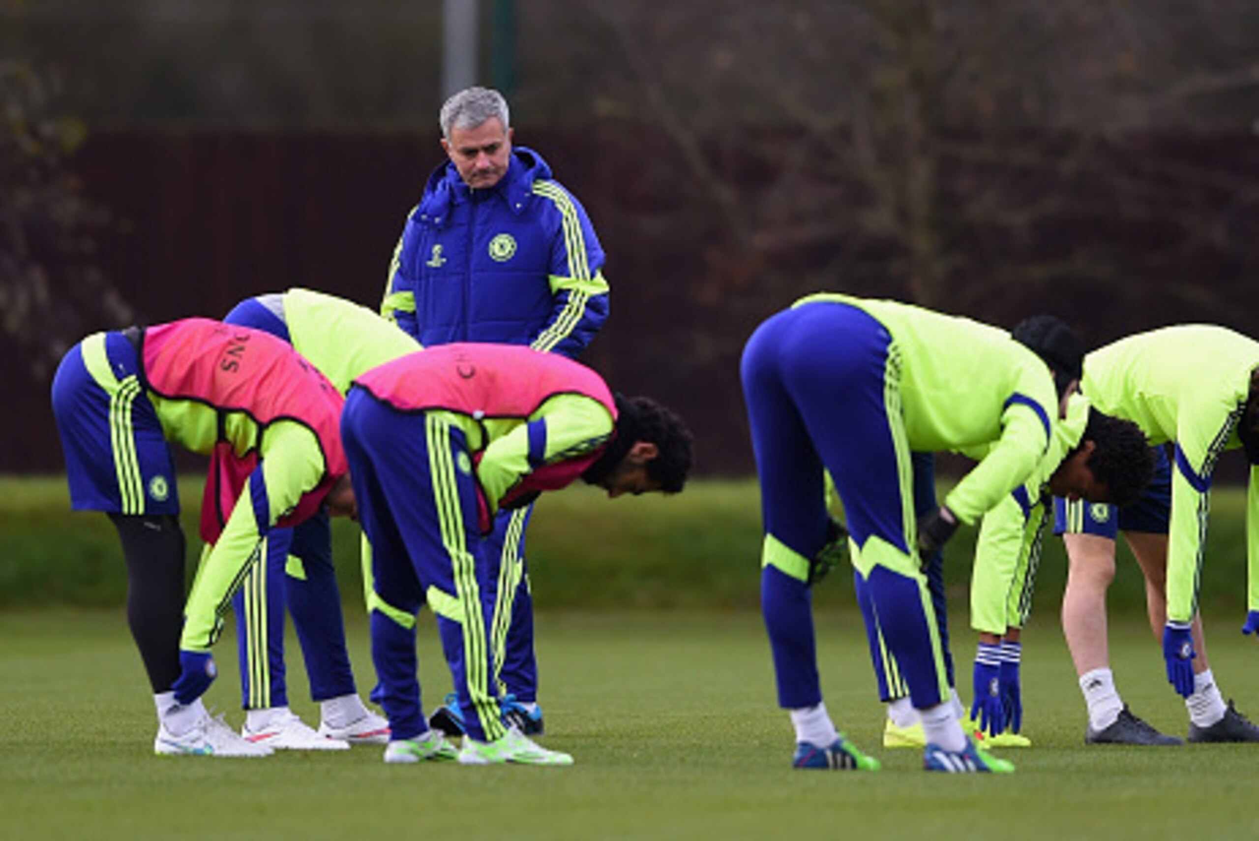 LONDON, ENGLAND - DECEMBER 09:  Manager Jose Mourinho of Chelsea looks on as his players warm up during a Chelsea press conference, ahead of the UEFA Champions League Group G match, against Sporting Clube de Portugal at Cobham Training Centre on December 