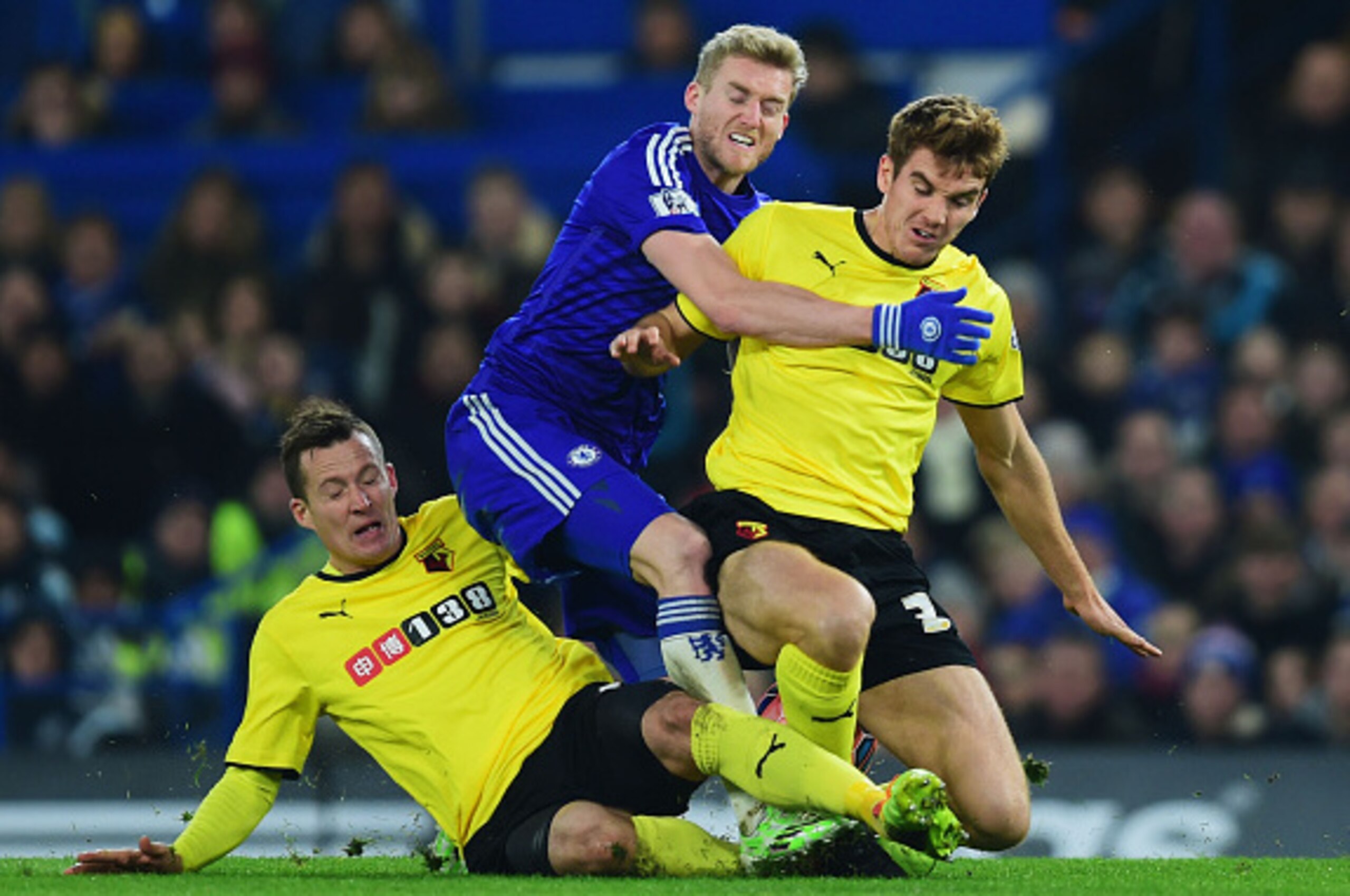 LONDON, ENGLAND - JANUARY 04:  Andre Schuerrle of Chelsea (C) is challenged by Daniel Tozser (L) and Tommie Hoban of Watford during the FA Cup Third Round match between Chelsea and Watford at Stamford Bridge on January 4, 2015 in London, England.  (Photo 