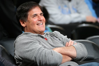 DENVER, CO - JANUARY 14:  Mark Cuban, owner of the Dallas Mavericks, sits courtside as his team warms up prior to facing the Denver Nuggets at Pepsi Center on January 14, 2015 in Denver, Colorado. NOTE TO USER: User expressly acknowledges and agrees that,
