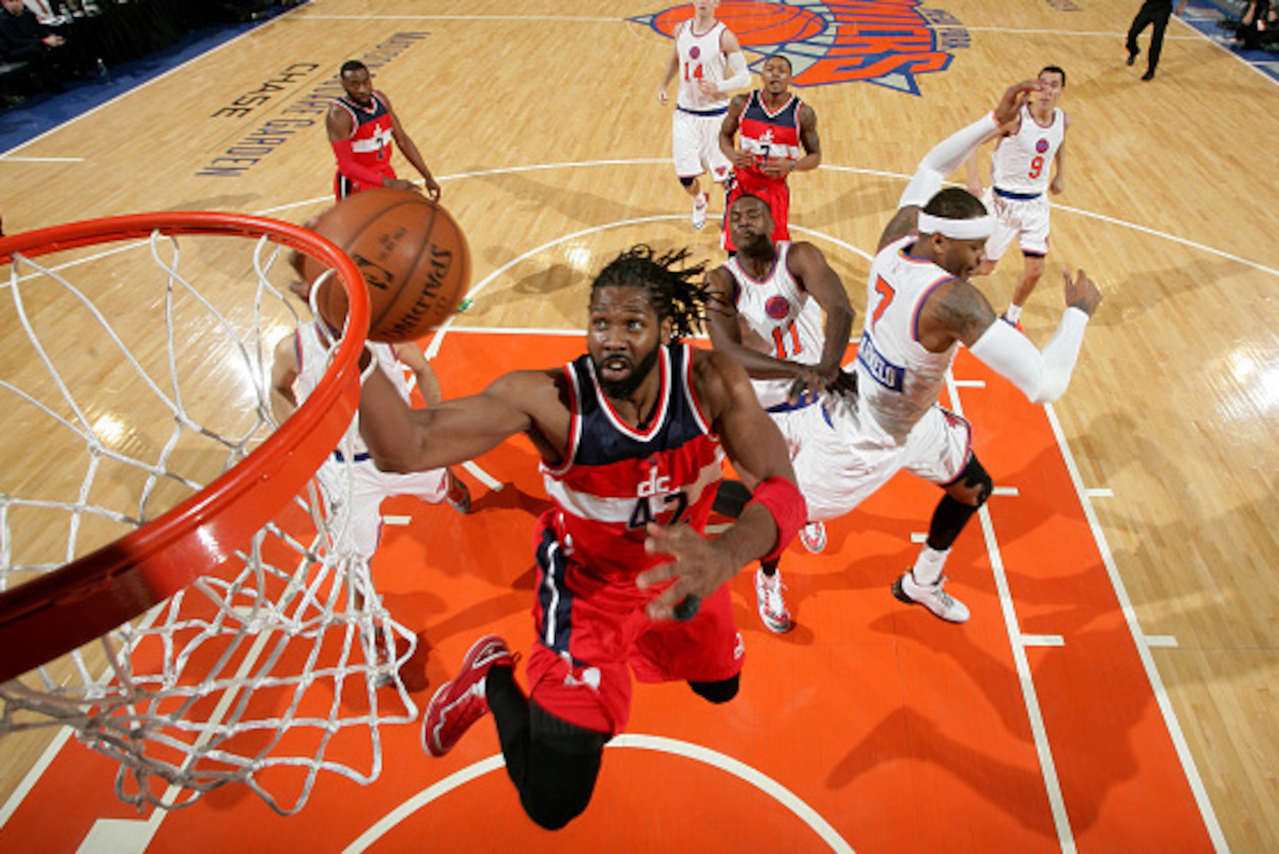 NEW YORK, NY - DECEMBER 25: Nene Hilario #42 of the Washington Wizards shoots during a game against the New York Knicks at Madison Square Garden on December 25, 2014 in New York, New York. NOTE TO USER: User expressly acknowledges and agrees that, by down