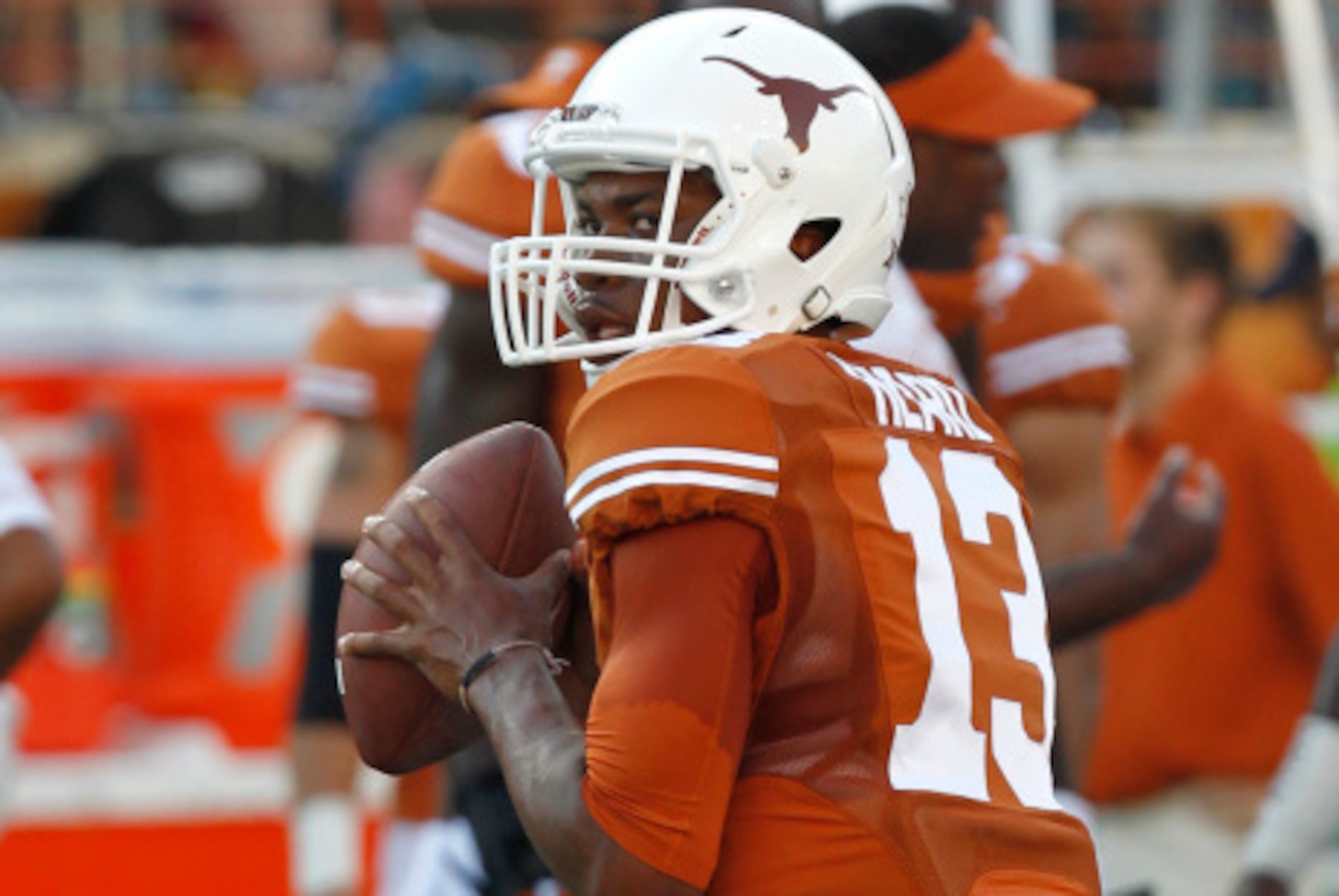AUSTIN, TX - SEPTEMBER 6: Jerrod Heard #13 of the Texas Longhorns passes during pre game warmups before playing the BYU Cougars on September 6, 2014 at Darrell K Royal-Texas Memorial Stadium in Austin, Texas. (Photo by Chris Covatta/Getty Images) AUSTIN, TX - SEPTEMBER 6: Jerrod Heard #13 of the Texas Longhorns passes during pre game warmups before playing the BYU Cougars on September 6, 2014 at Darrell K Royal-Texas Memorial Stadium in Austin, Texas. (Photo by Chris Covatta/Getty Images)