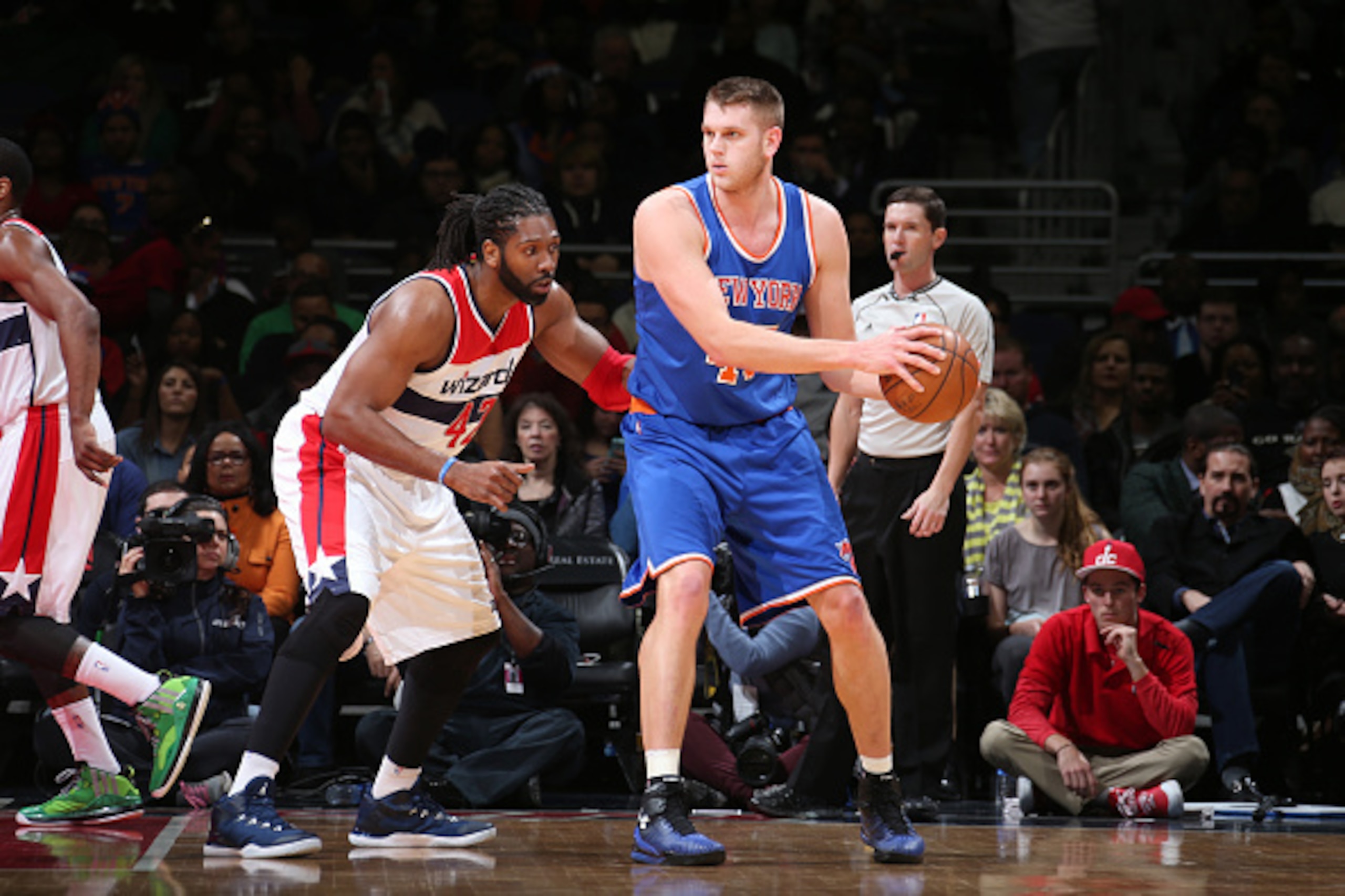 WASHINGTON, DC - JANUARY 7: Cole Aldrich #45 of the New York Knicks defends the ball against Nene Hilario #42 of the Washington Wizards during the game on January 7, 2015 at Verizon Center in Washington, DC. NOTE TO USER: User expressly acknowledges and WASHINGTON, DC - JANUARY 7: Cole Aldrich #45 of the New York Knicks defends the ball against Nene Hilario #42 of the Washington Wizards during the game on January 7, 2015 at Verizon Center in Washington, DC. NOTE TO USER: User expressly acknowledges and