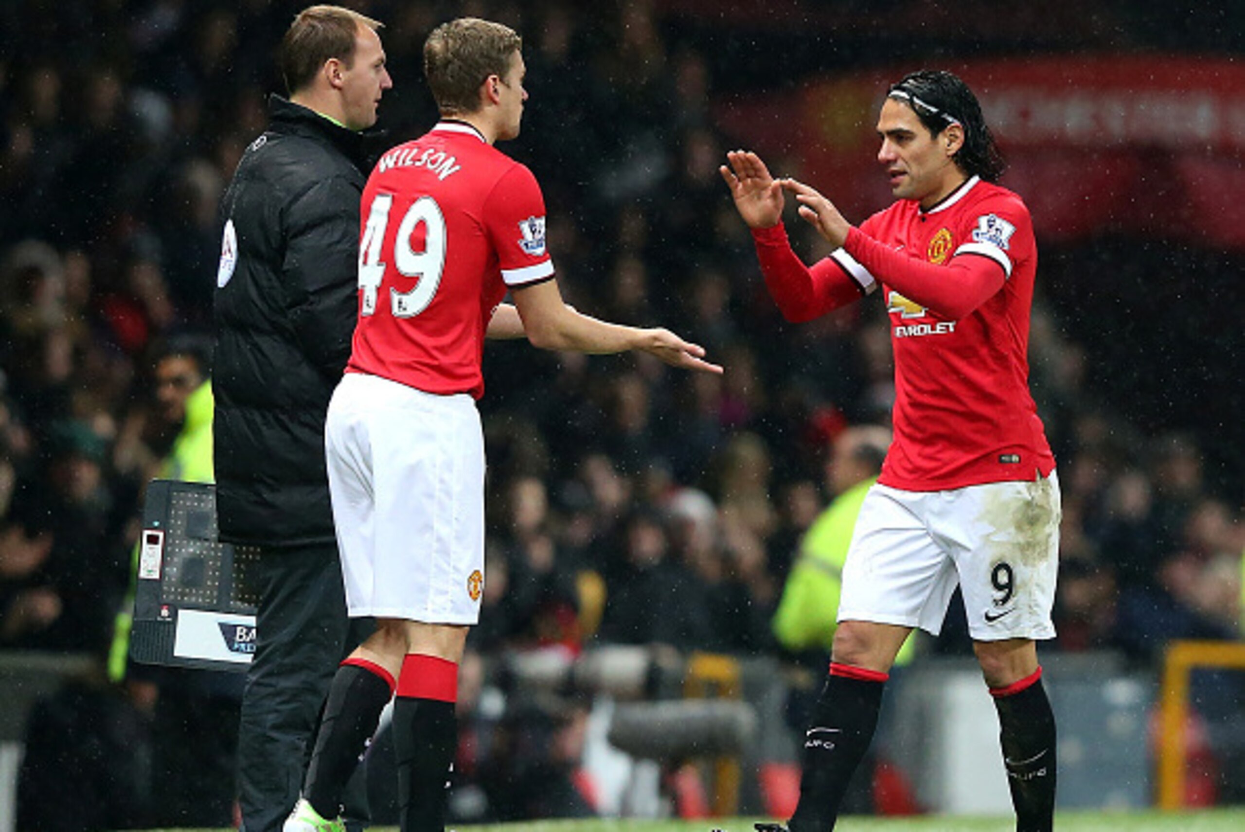 MANCHESTER, ENGLAND - DECEMBER 26: James Wilson of Manchester United replaces team-mate Radamel Falcao during the Barclays Premier League match between Manchester United and Newcastle United at Old Trafford on December 26, 2014 in Manchester, England. MANCHESTER, ENGLAND - DECEMBER 26: James Wilson of Manchester United replaces team-mate Radamel Falcao during the Barclays Premier League match between Manchester United and Newcastle United at Old Trafford on December 26, 2014 in Manchester, England.
