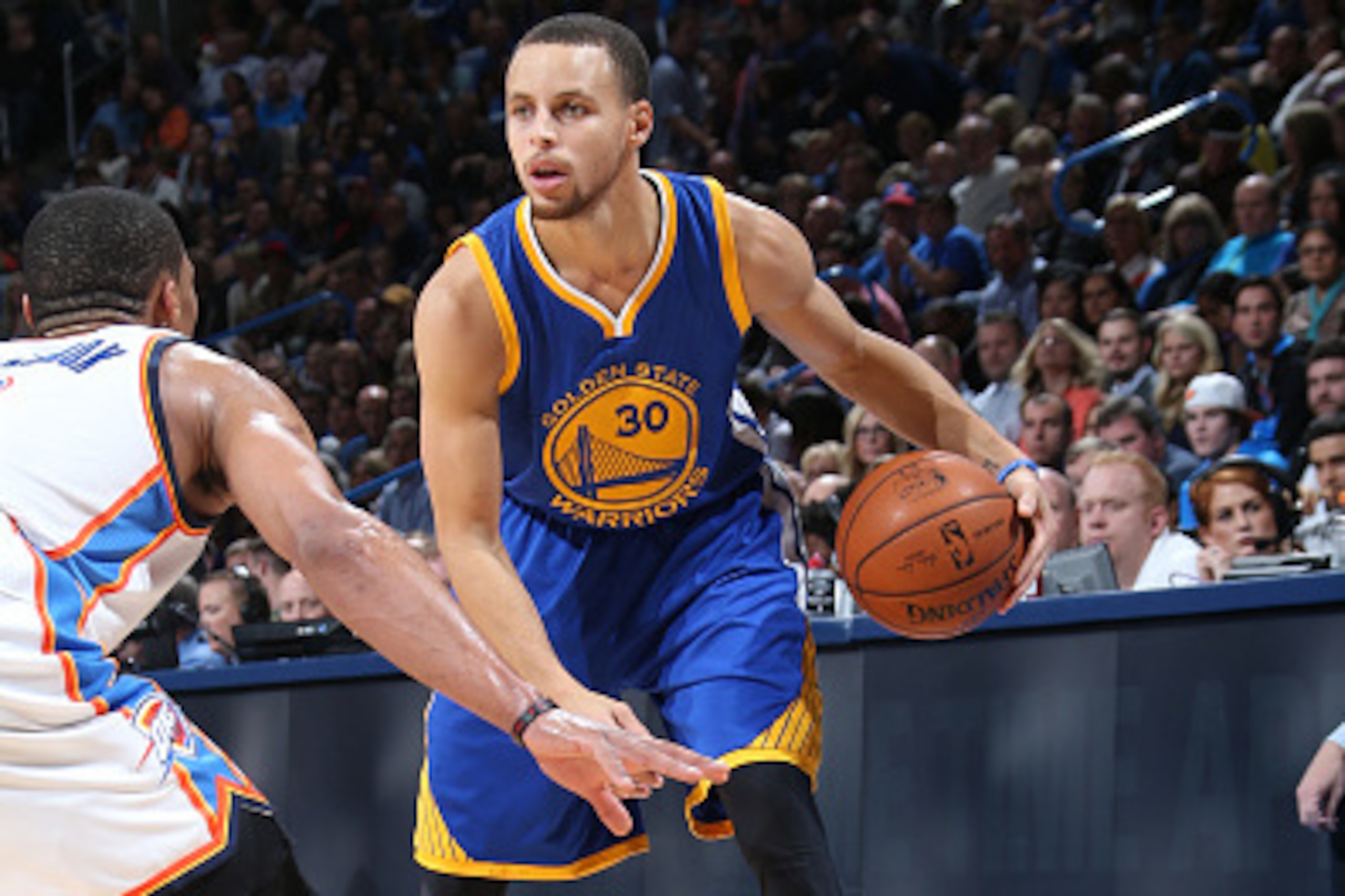 OKLAHOMA CITY, OK- JANUARY 16: Stephen Curry #30 of the Golden State Warriors handles the ball against the Oklahoma City Thunder on January 16, 2015 at Chesapeake Energy Arena in Oklahoma City, OK. NOTE TO USER: User expressly acknowledges and agrees that
