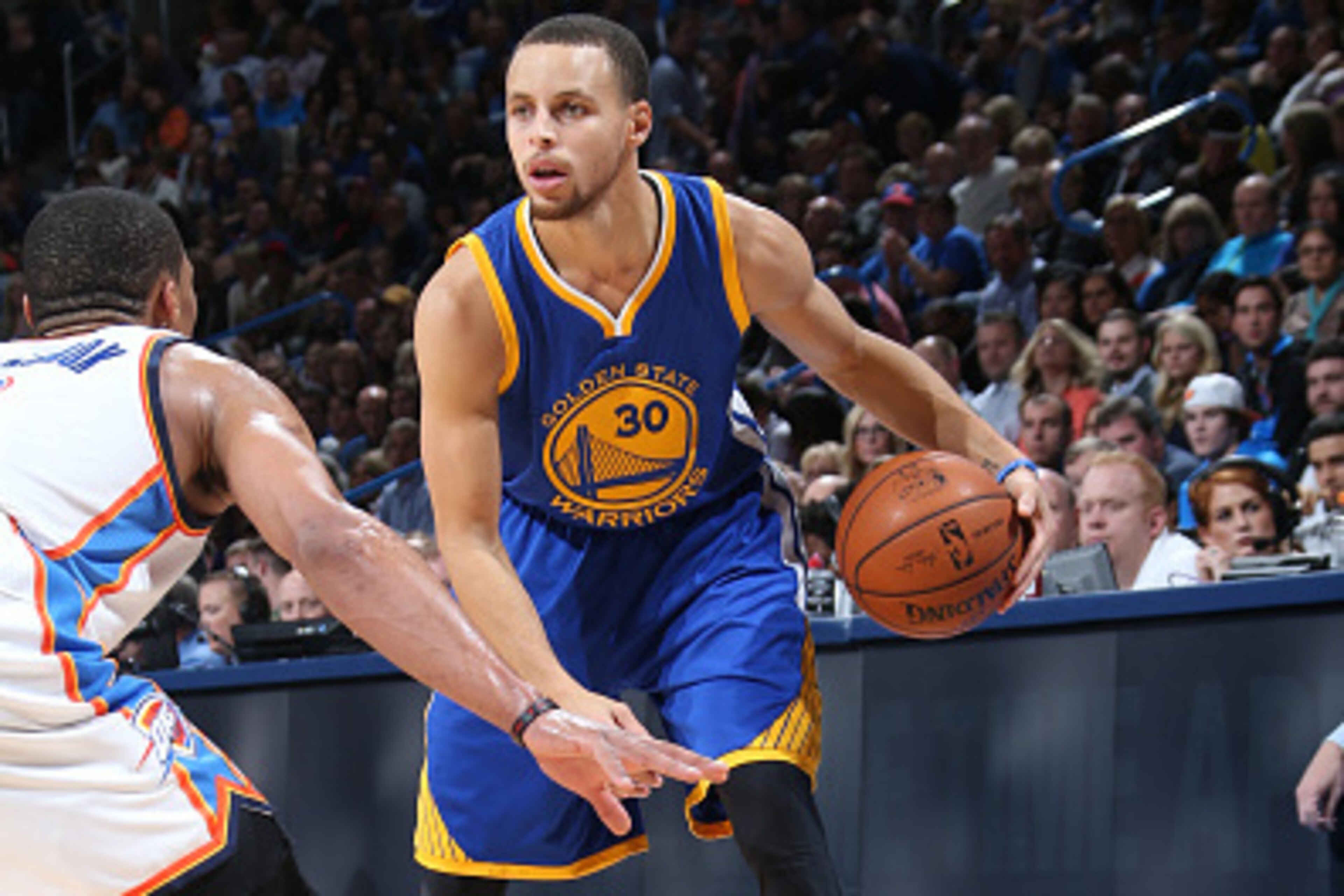 OKLAHOMA CITY, OK- JANUARY 16: Stephen Curry #30 of the Golden State Warriors handles the ball against the Oklahoma City Thunder on January 16, 2015 at Chesapeake Energy Arena in Oklahoma City, OK. NOTE TO USER: User expressly acknowledges and agrees that