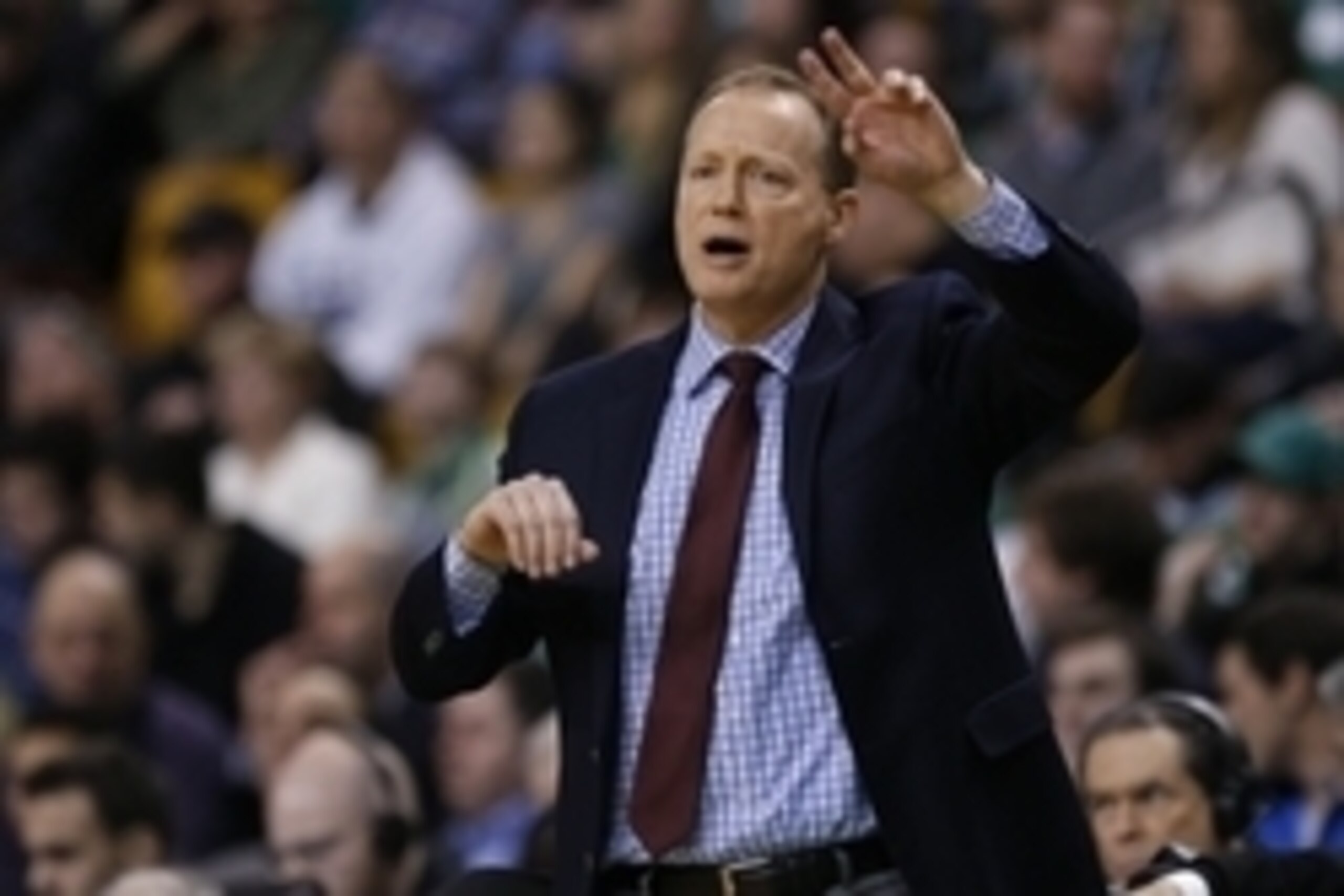 Jan 14, 2015; Boston, MA, USA; Atlanta Hawks head coach Mike Budenholzer makes a call from the side line during the fourth quarter against the Boston Celtics at TD Garden.  The Atlanta Hawks won 105-91. Mandatory Credit: Greg M. Cooper-USA TODAY Sports