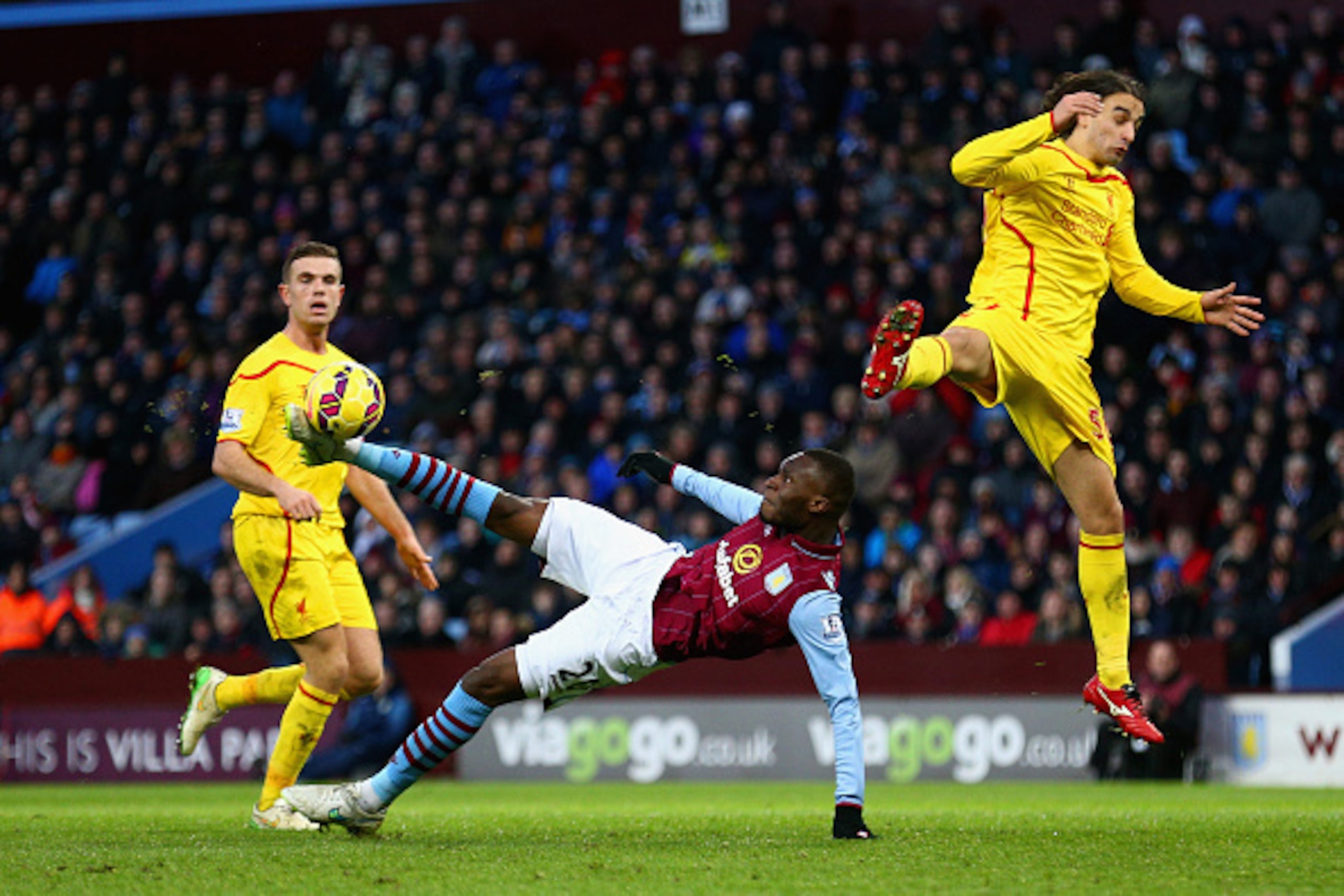 BIRMINGHAM, ENGLAND - JANUARY 17:  Christian Benteke of Aston Villa makes an attempt Referee Anthony Taylor goal during the Barclays Premier League match between Aston Villa and Liverpool at Villa Park on January 17, 2015 in Birmingham, England.  (Photo b