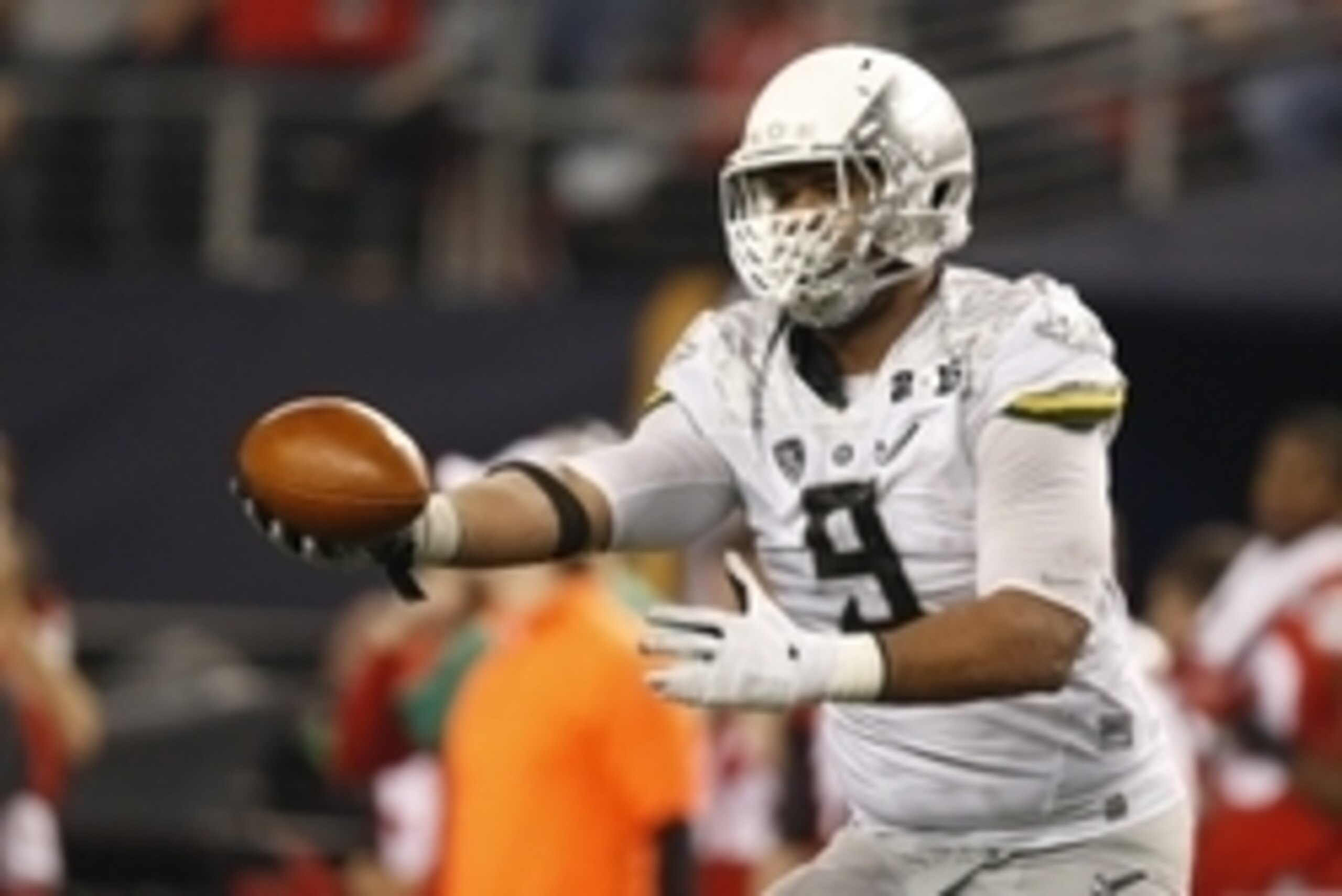 Jan 12, 2015; Arlington, TX, USA; Oregon Ducks defensive lineman Arik Armstead (9) celebrates recovering a fumble during the third quarter against the Ohio State Buckeyes in the 2015 CFP National Championship Game at AT&T Stadium. Mandatory Credit: Tim He