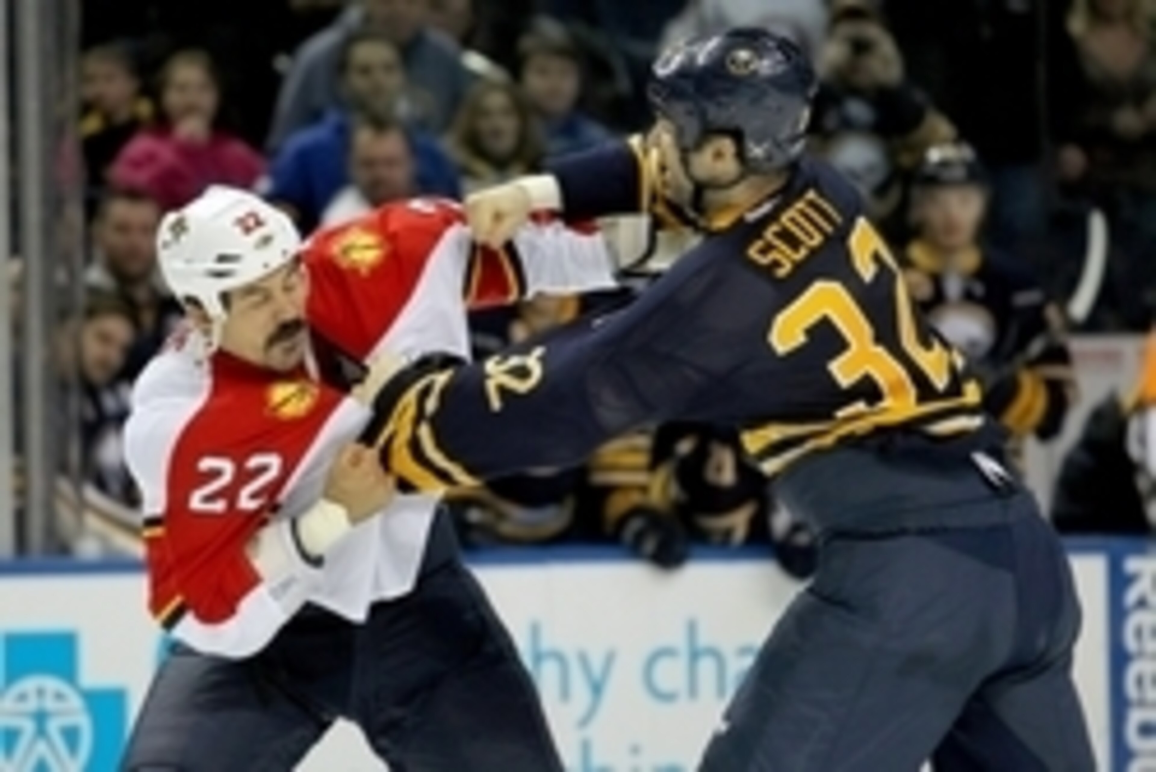 Feb. 3, 2013; Buffalo, NY, USA; Florida Panthers right wing George Parros (22) and Buffalo Sabres left wing John Scott (32) fight during the second period at First Niagara Center. Mandatory Credit: Timothy T. Ludwig-USA TODAY Sports Feb. 3, 2013; Buffalo, NY, USA; Florida Panthers right wing George Parros (22) and Buffalo Sabres left wing John Scott (32) fight during the second period at First Niagara Center. Mandatory Credit: Timothy T. Ludwig-USA TODAY Sports