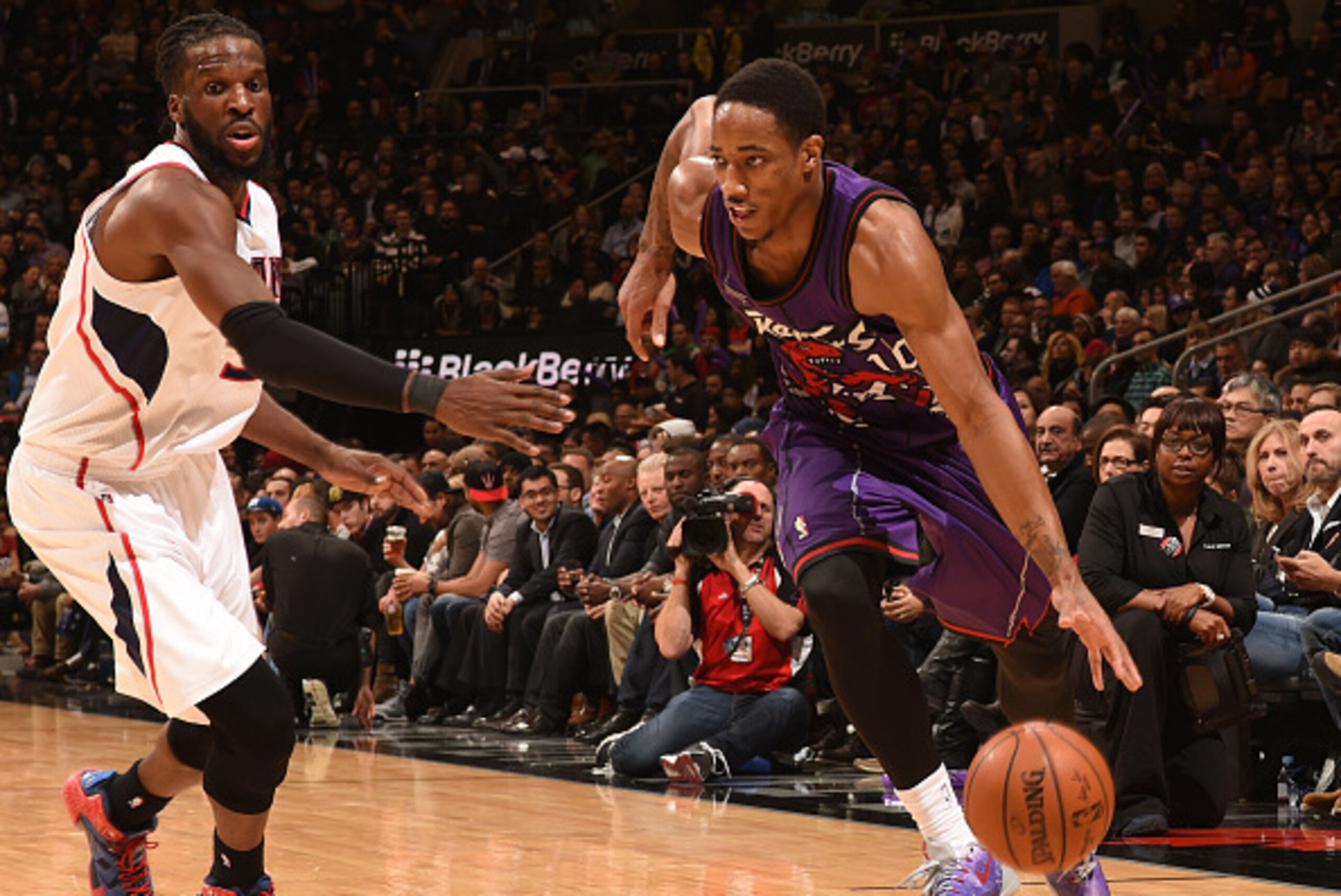 TORONTO, ON - JANUARY 16:  DeMar DeRozan #10 of the Toronto Raptors handles the ball against the Atlanta Hawks on January 16, 2015 at the Air Canada Centre in Toronto, Ontario, Canada. NOTE TO USER: User expressly acknowledges and agrees that, by download
