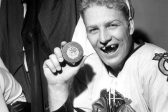 NHL Hall of Famer Bobby Hull flashes his lack of pearly whites.