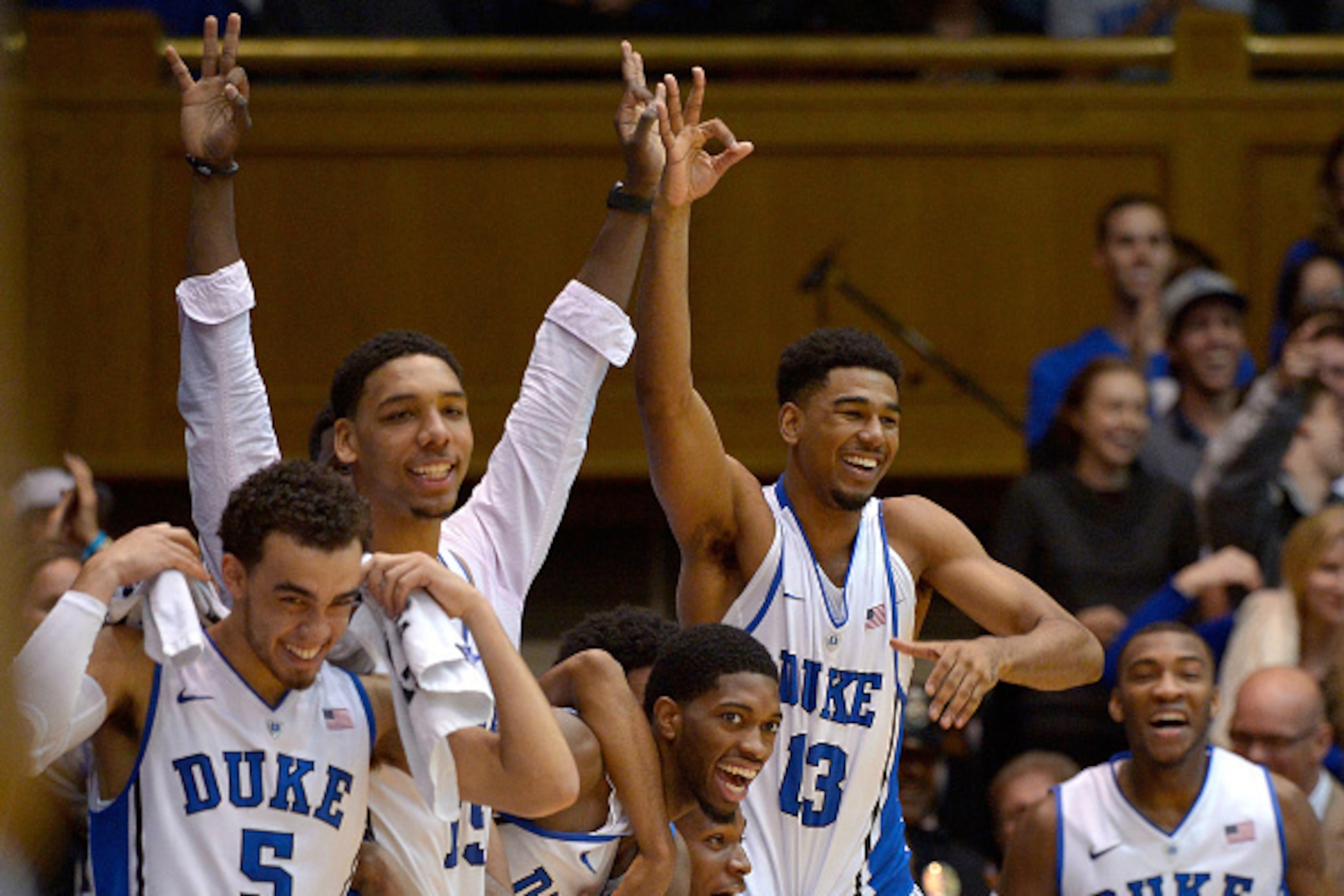 DURHAM, NC - NOVEMBER 14:  The bench reacts after a three-point basket by Marshall Plumlee #40 of the Duke Blue Devils during the final seconds of their game against the Presbyterian Blue Hose at Cameron Indoor Stadium on November 14, 2014 in Durham, Nort