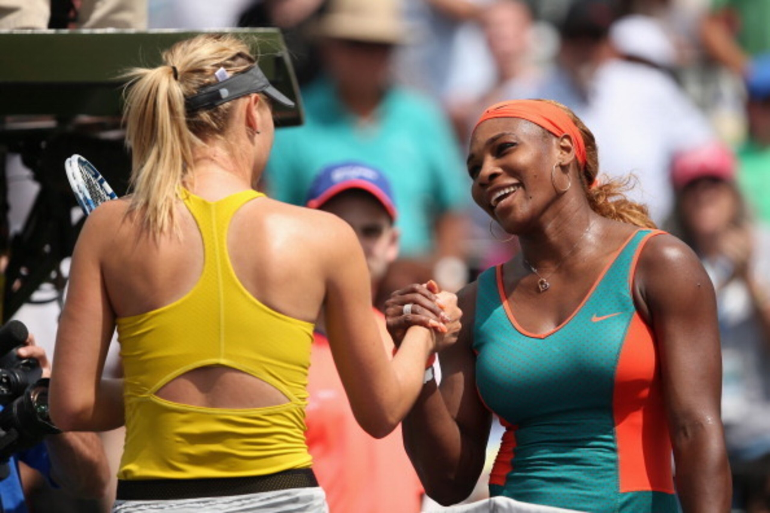 KEY BISCAYNE, FL - MARCH 27:  Serena Williams of the United States shakes hands at the net after her straight sets victory against Maria Sharapova of Russia during their semi final round match during day 11 at the Sony Open at Crandon Park Tennis Cente on
