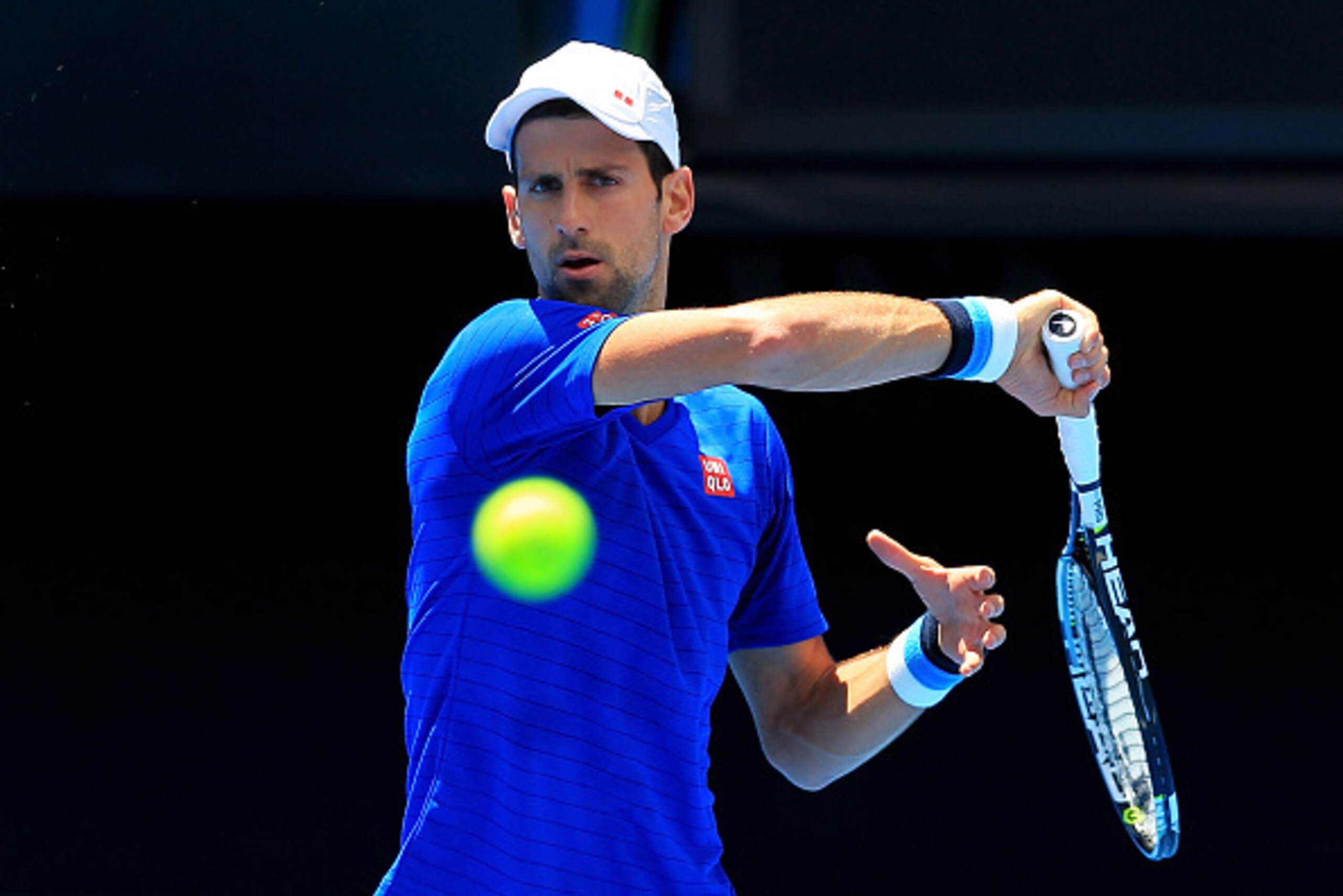 MELBOURNE, AUSTRALIA - JANUARY 16:  Novak Djokovic of Serbia plays a forehand during a practice session ahead of the 2015 Australian Open at Melbourne Park on January 16, 2015 in Melbourne, Australia.  (Photo by Graham Denholm/Getty Images)