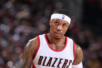 PORTLAND, OR - JANUARY 8:  Damian Lillard #0 of the Portland Trail Blazers stands on the court against the Miami Heat on January 8, 2015 at the Moda Center Arena in Portland, Oregon. NOTE TO USER: User expressly acknowledges and agrees that, by downloadin