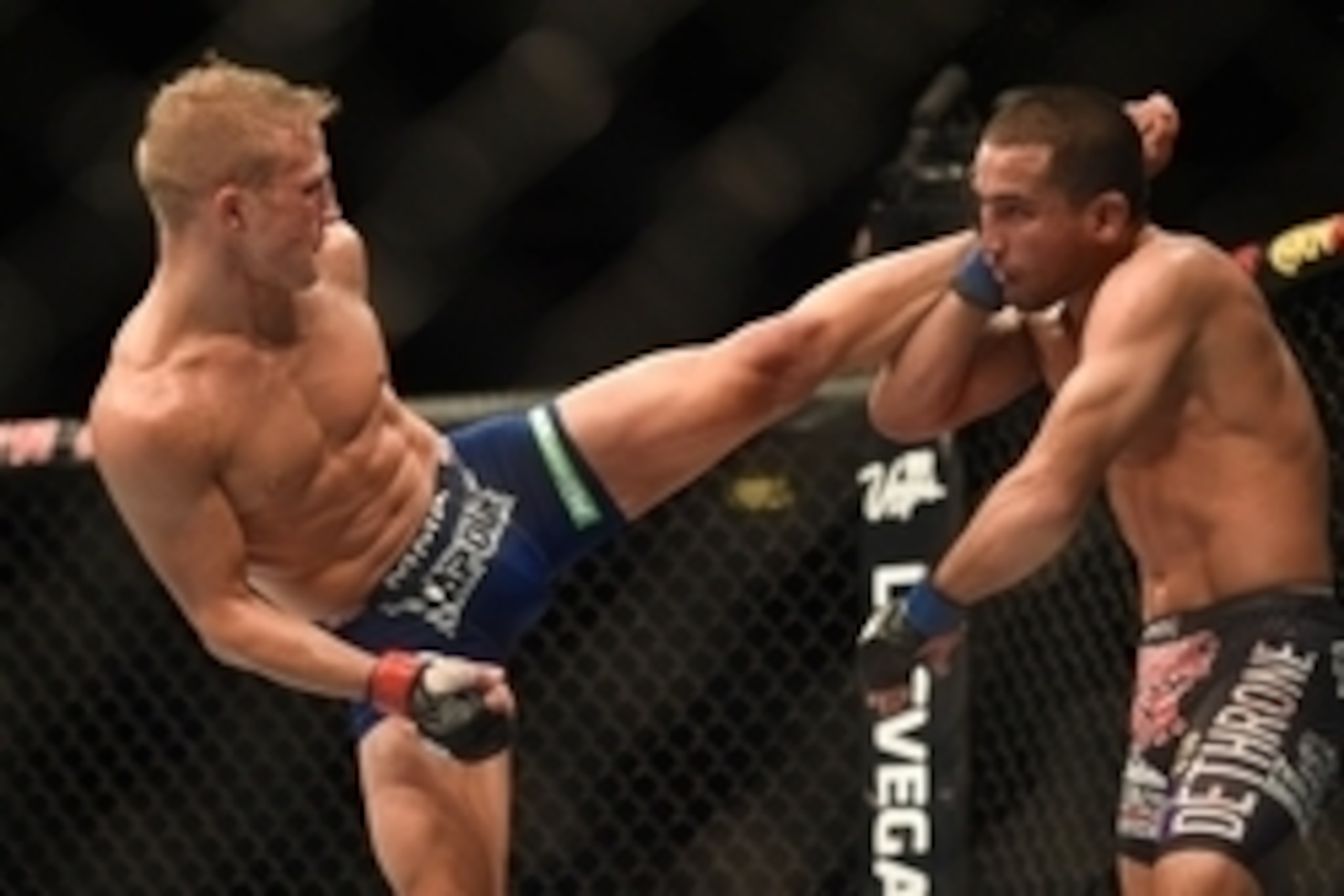 August 30, 2014; Sacramento, CA, USA; T.J. Dillashaw (red gloves) fights against Joe Soto (blue gloves) during the bantamweight title bout of UFC 177 at Sleep Train Arena. Mandatory Credit: Kyle Terada-USA TODAY Sports