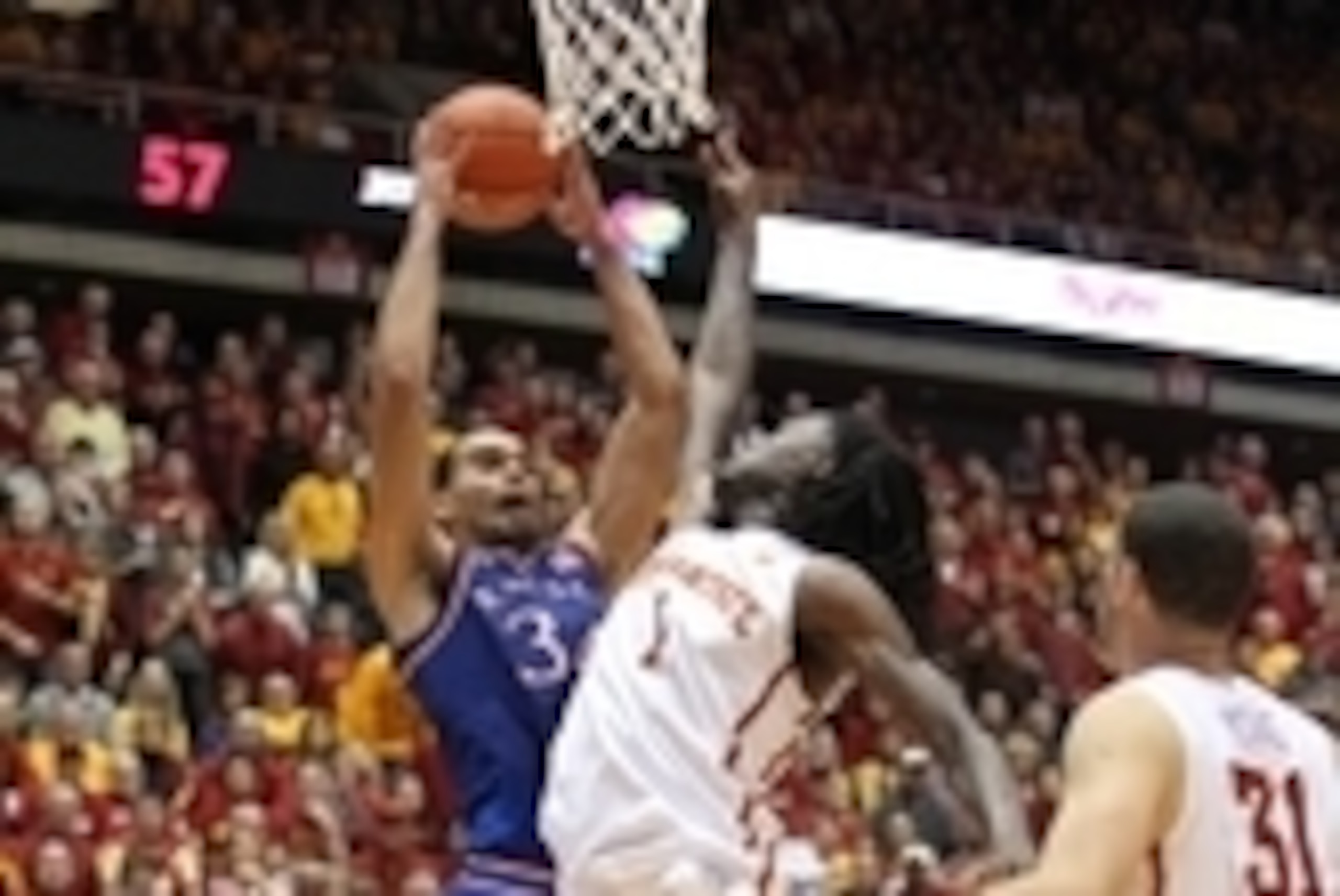 Jan 17, 2015; Ames, IA, USA; Iowa State Cyclones forward Jameel McKay (1) defends the shot of Kansas Jayhawks forward Perry Ellis (34) at James H. Hilton Coliseum. Iowa State beat Kansas 86-81.  Mandatory Credit: Reese Strickland-USA TODAY Sports