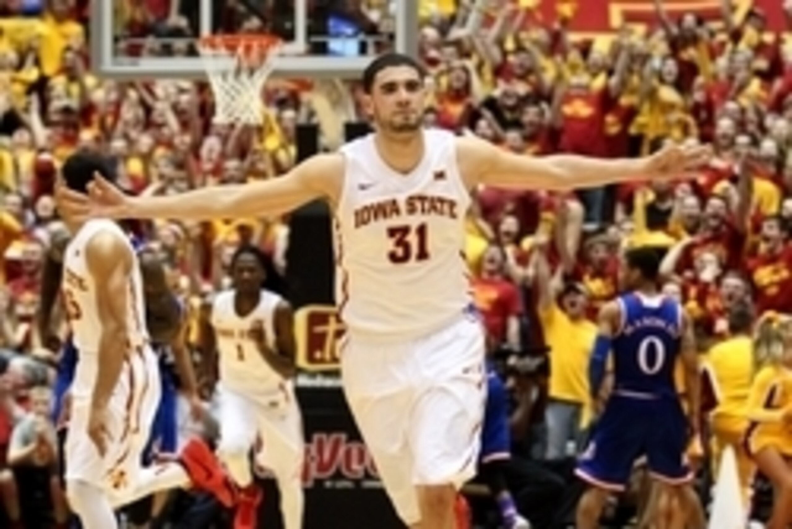 Jan 17, 2015; Ames, IA, USA; Iowa State Cyclones forward Georges Niang (31) signals a three pointer to the crowd during their game against the Kansas Jayhawks at James H. Hilton Coliseum. Iowa State beat Kansas 86-81.  Mandatory Credit: Reese Strickland-U
