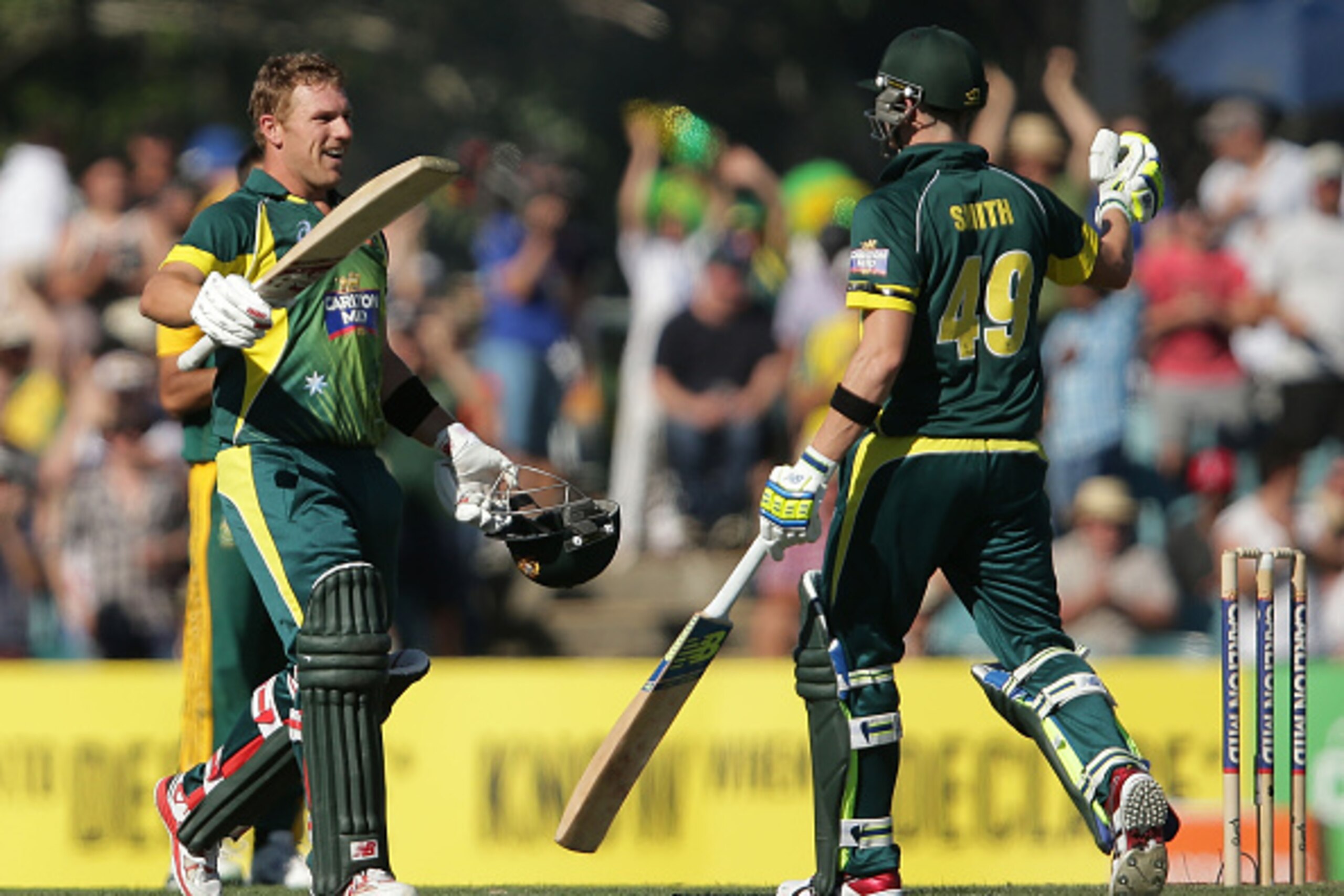 CANBERRA, AUSTRALIA - NOVEMBER 19:  Aaron Finch of Australia celebrates with Steven Smith after scoring a century during game three of the One Day International Series between Australia and South Africa at Manuka Oval on November 19, 2014 in Canberra, Aus