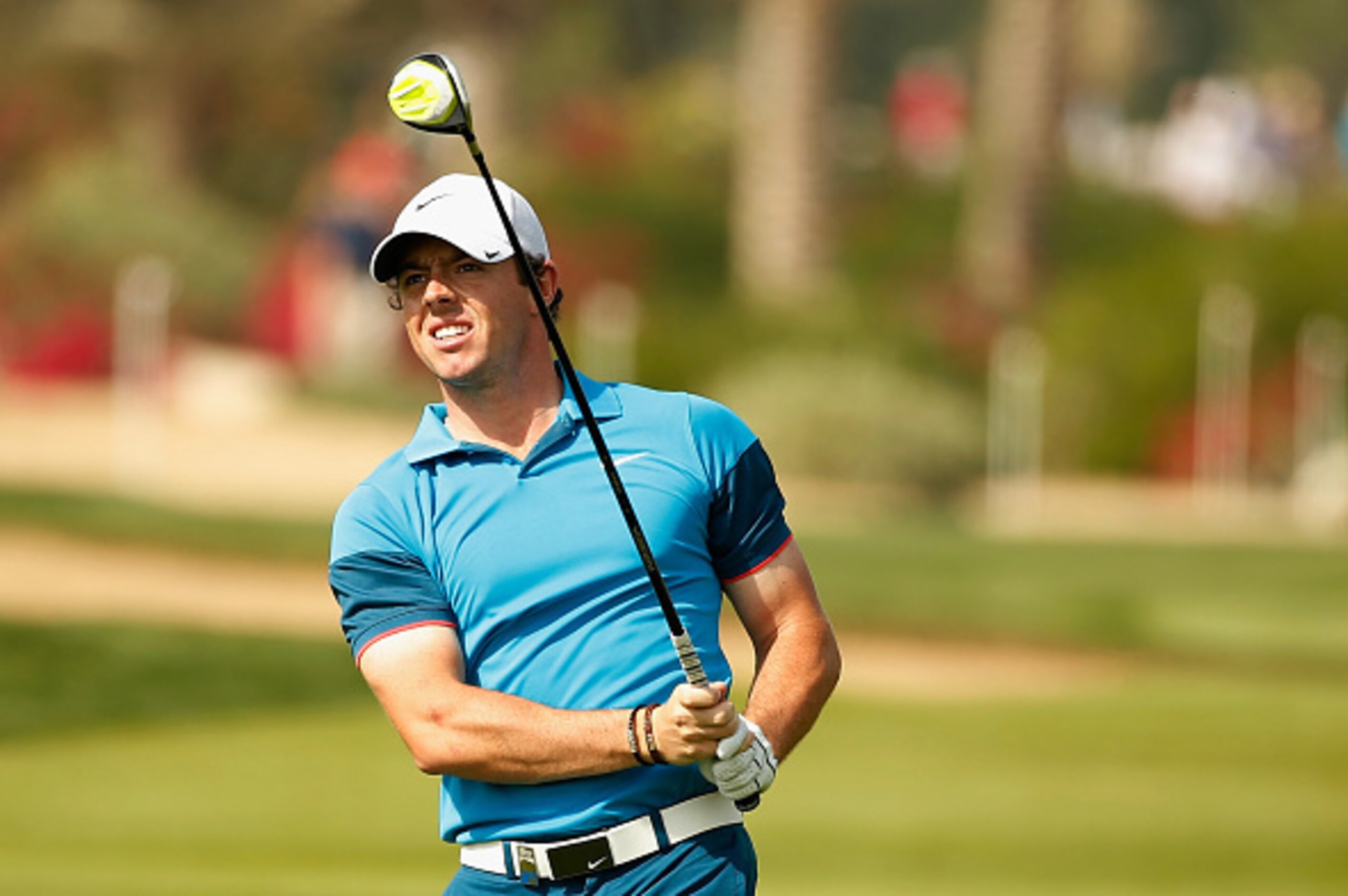 ABU DHABI, UNITED ARAB EMIRATES - JANUARY 18:  Rory McIlroy of Northern Ireland watches his approach shot on the second hole during the final round of the Abu Dhabi HSBC Golf Championship at the Abu Dhabi Golf Cub on January 18, 2015 in Abu Dhabi, United 