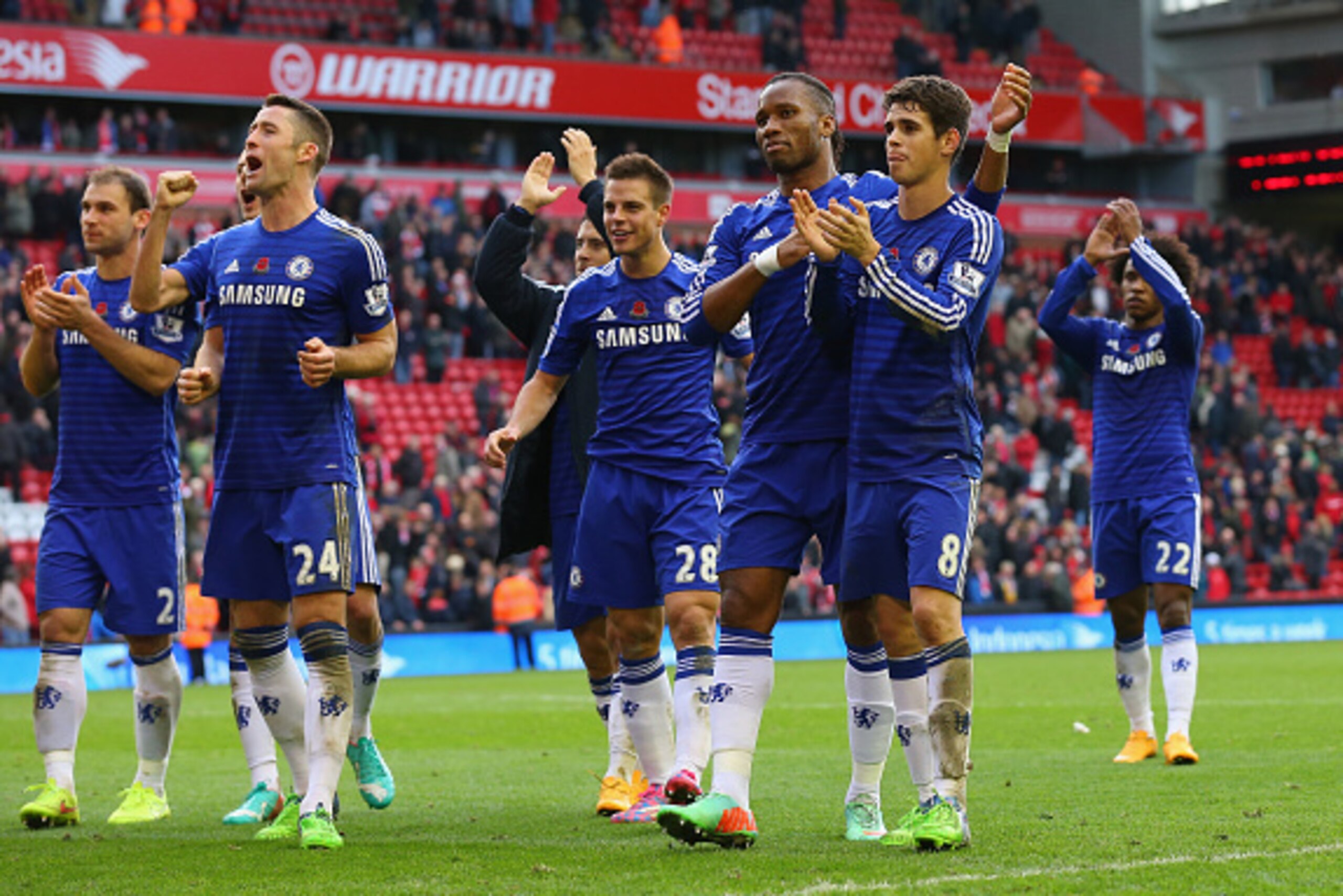 LIVERPOOL, ENGLAND - NOVEMBER 08:  Gary Cahill, Didier Drogba and Oscar of Chelsea celebrate victory after the Barclays Premier League match between Liverpool and Chelsea at Anfield on November 8, 2014 in Liverpool, England.  (Photo by Alex Livesey/Getty 
