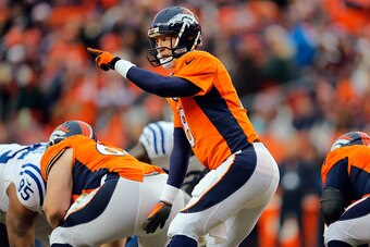 DENVER, CO - JANUARY 11:  Peyton Manning #18 of the Denver Broncos calls a play against the Indianapolis Colts during a 2015 AFC Divisional Playoff game at Sports Authority Field at Mile High on January 11, 2015 in Denver, Colorado.  (Photo by Doug Pensin