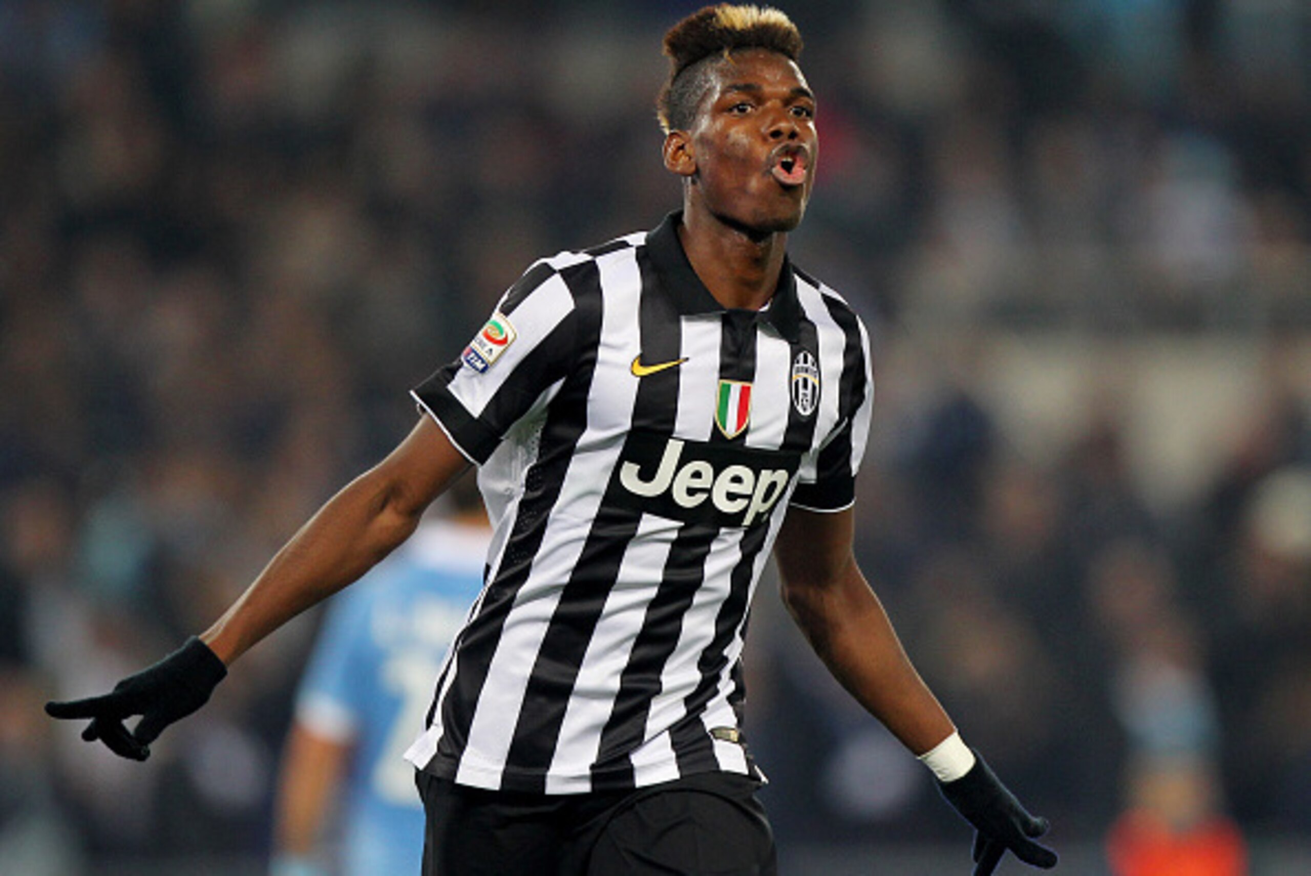 ROME, ITALY - NOVEMBER 22:  Paul Pogba of Juventus FC celebrates after scoring the opening goal during the Serie A match between SS Lazio and Juventus FC at Stadio Olimpico on November 22, 2014 in Rome, Italy.  (Photo by Paolo Bruno/Getty Images)