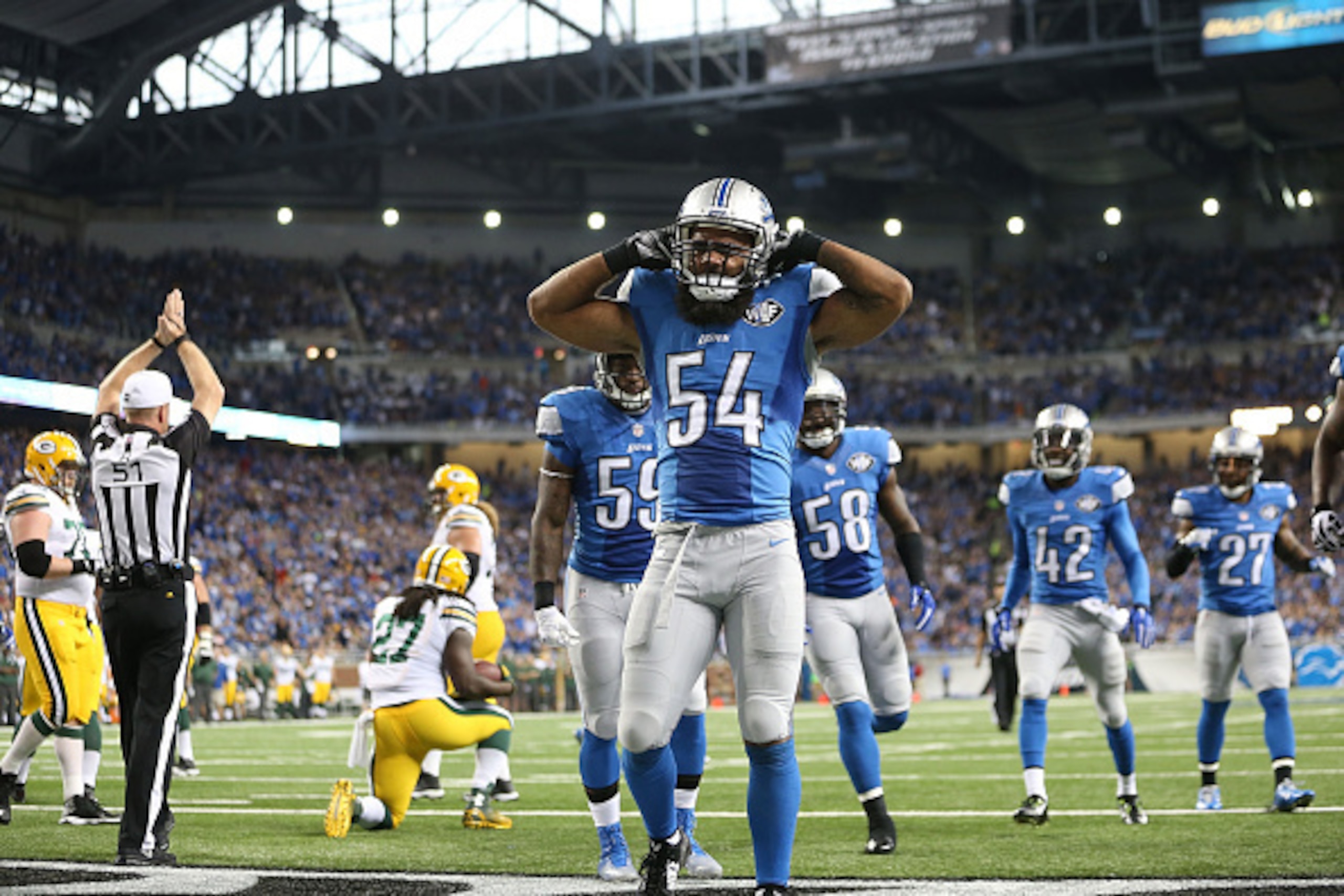 DETROIT, MI - SEPTEMBER 21: DeAndre Levy #54 of the Detroit Lions celebrates after tackling Eddie Lacy #27 of the Green Bay Packers for a safety during the second quarter of the game at Ford Field on September 21, 2014 in Detroit, Michigan.  (Photo by Leo