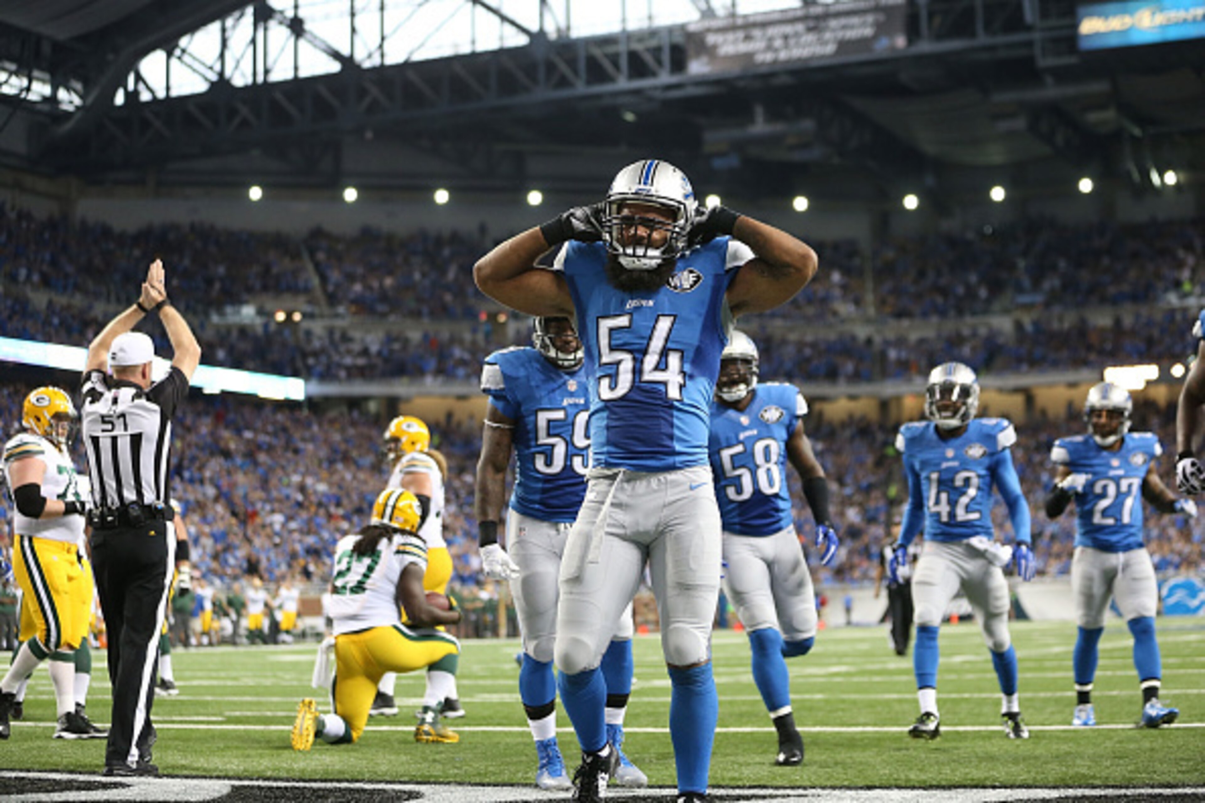 DETROIT, MI - SEPTEMBER 21: DeAndre Levy #54 of the Detroit Lions celebrates after tackling Eddie Lacy #27 of the Green Bay Packers for a safety during the second quarter of the game at Ford Field on September 21, 2014 in Detroit, Michigan. (Photo by Leo DETROIT, MI - SEPTEMBER 21: DeAndre Levy #54 of the Detroit Lions celebrates after tackling Eddie Lacy #27 of the Green Bay Packers for a safety during the second quarter of the game at Ford Field on September 21, 2014 in Detroit, Michigan. (Photo by Leo