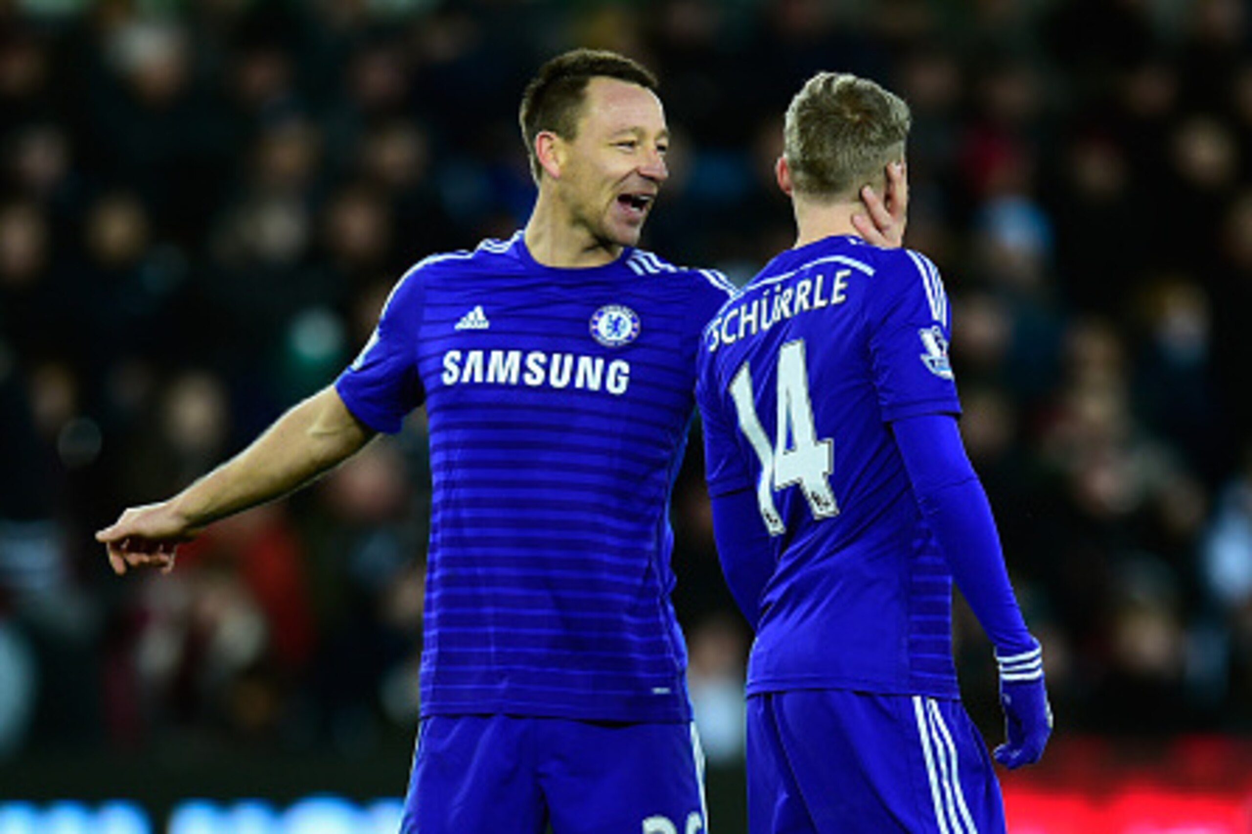 SWANSEA, WALES - JANUARY 17:  Chelsea player Andre Schurrle celebrates after scoring the fifth goal with John Terry (l) during the Barclays Premier League match between Swansea City and Chelsea at Liberty Stadium on January 17, 2015 in Swansea, Wales.  (P