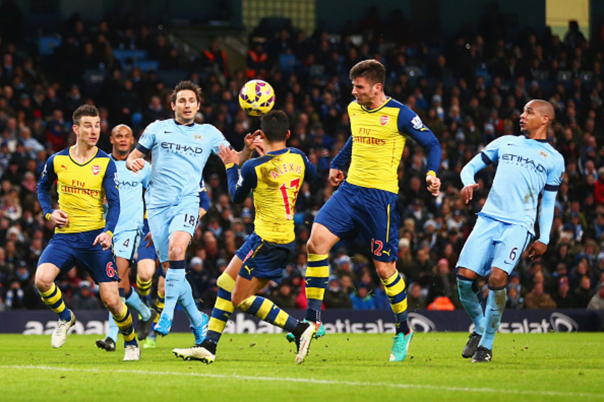 MANCHESTER, ENGLAND - JANUARY 18:  Olivier Giroud of Arsenal (12) scores their second goal during the Barclays Premier League match between Manchester City and Arsenal at Etihad Stadium on January 18, 2015 in Manchester, England.  (Photo by Michael Steele