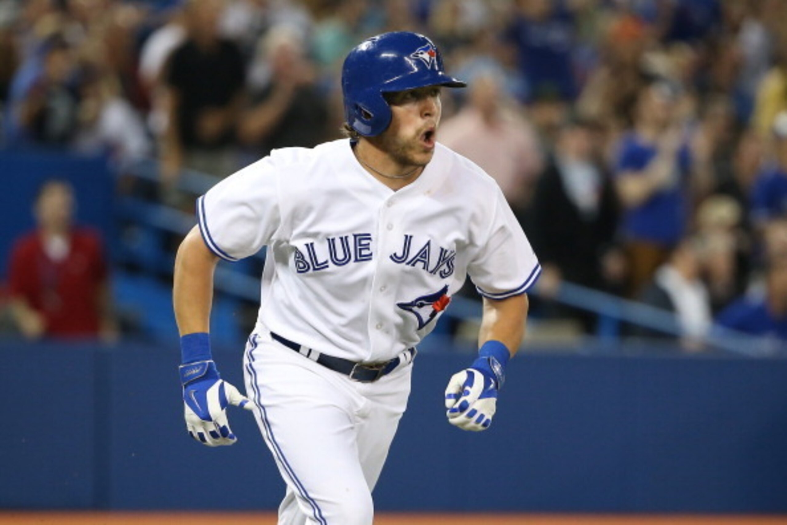 TORONTO, CANADA - JUNE 24:  Colby Rasmus #28 of the Toronto Blue Jays heads to first base after hitting a three-run single in the fifth inning during MLB game action against the New York Yankees on June 24, 2014 at Rogers Centre in Toronto, Ontario, Canad
